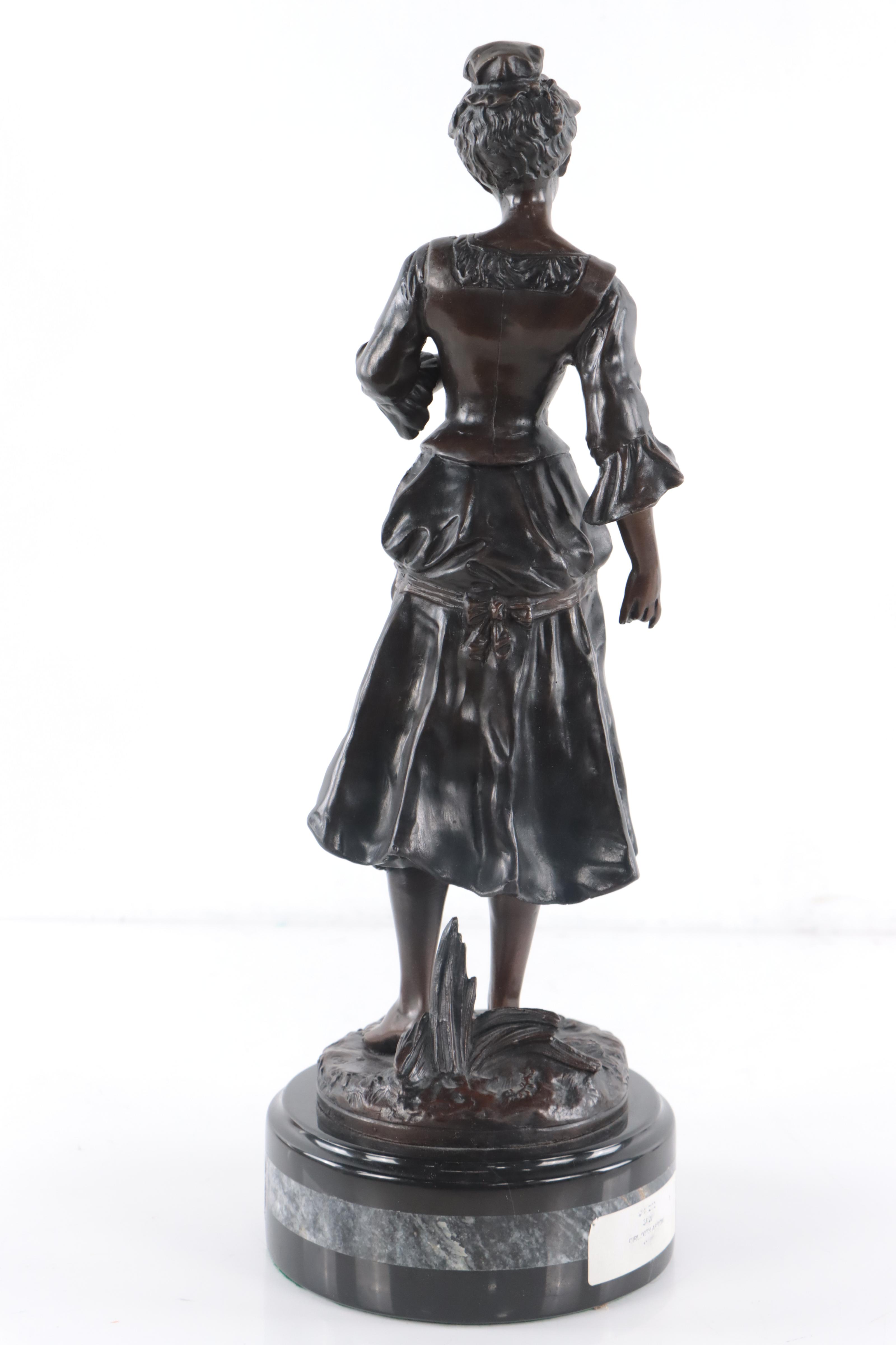 Bronze Sculpture of Woman Holding Flowers