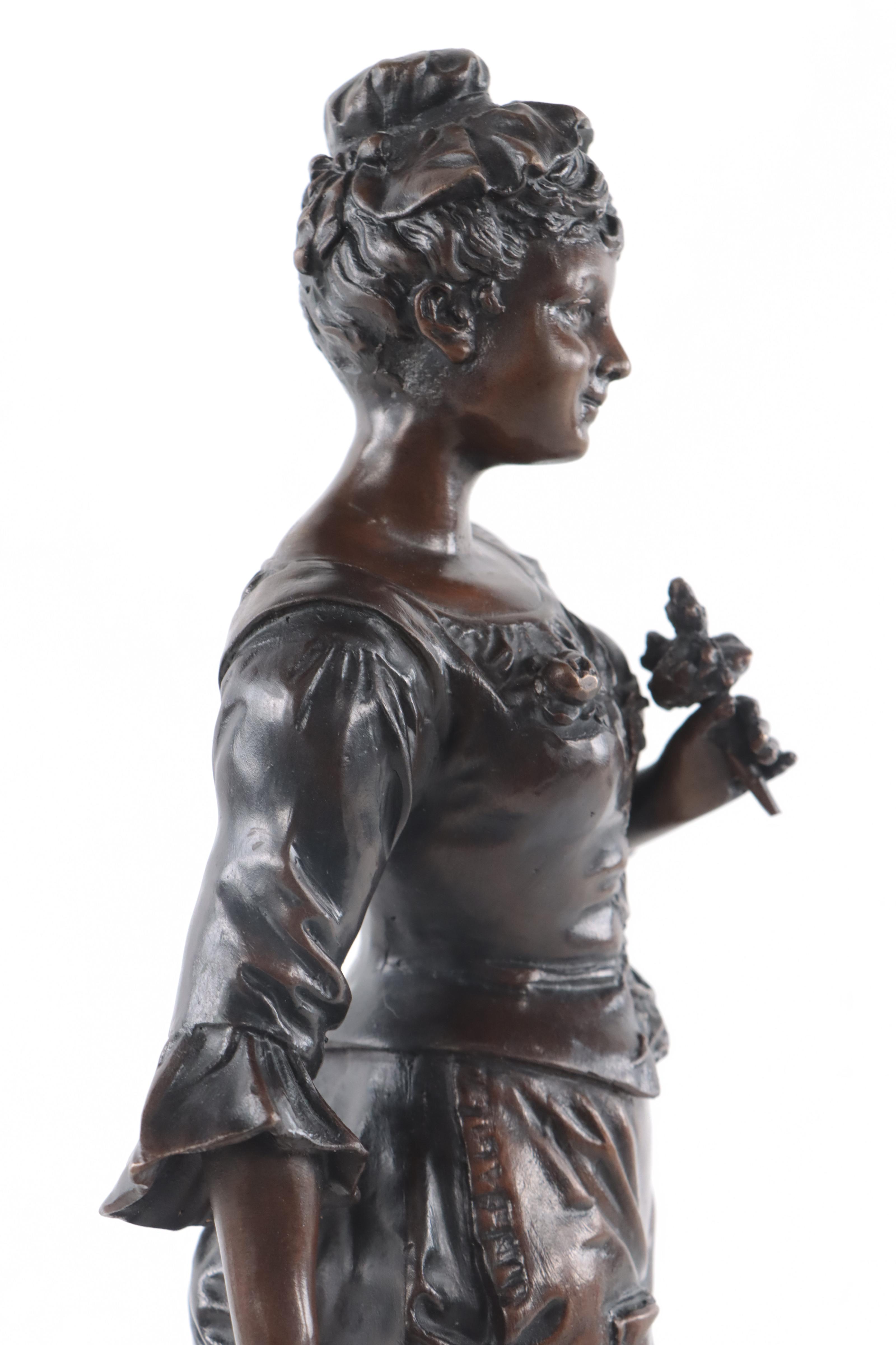 Bronze Sculpture of Woman Holding Flowers
