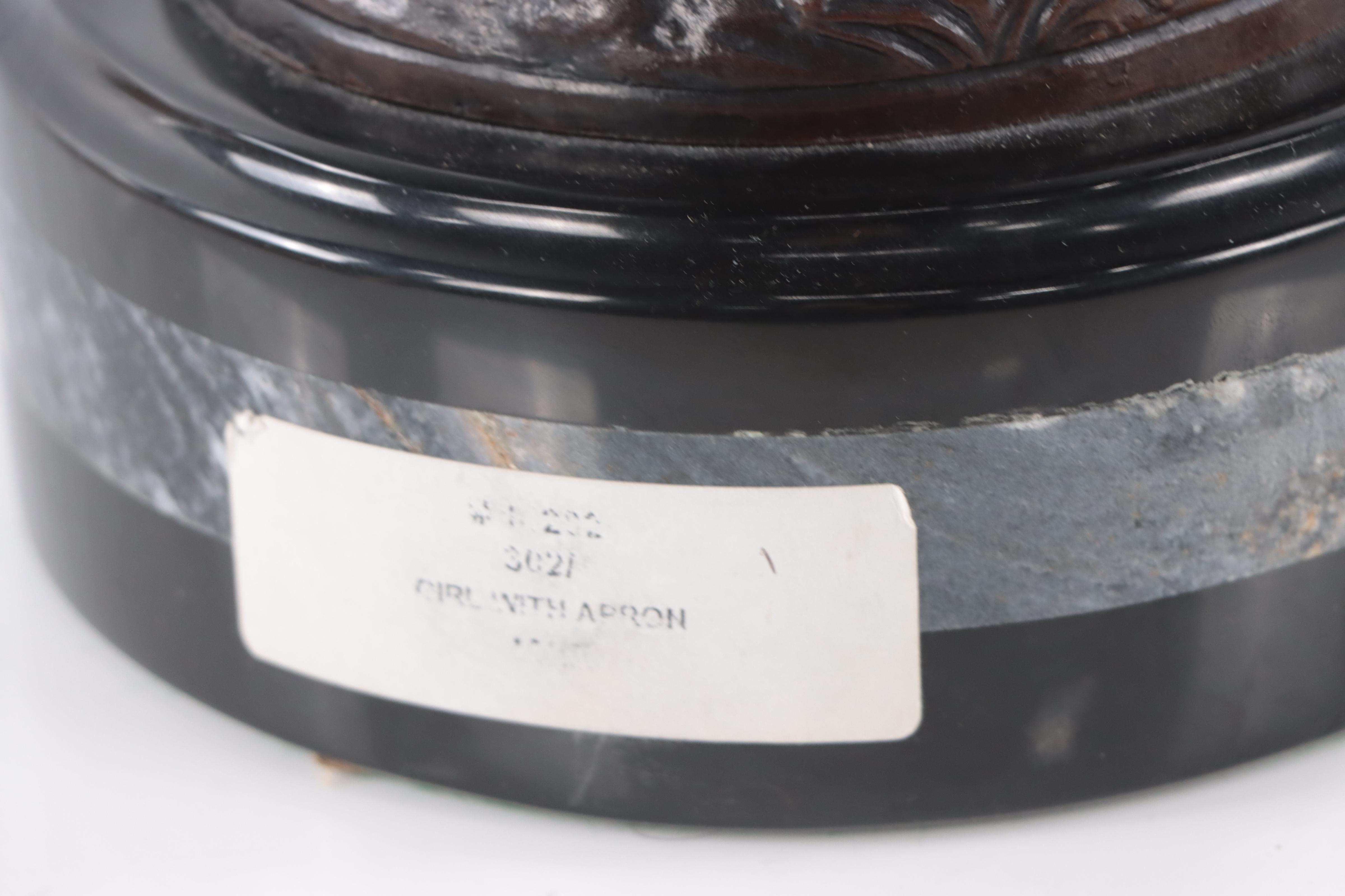 Bronze Sculpture of Woman Holding Flowers