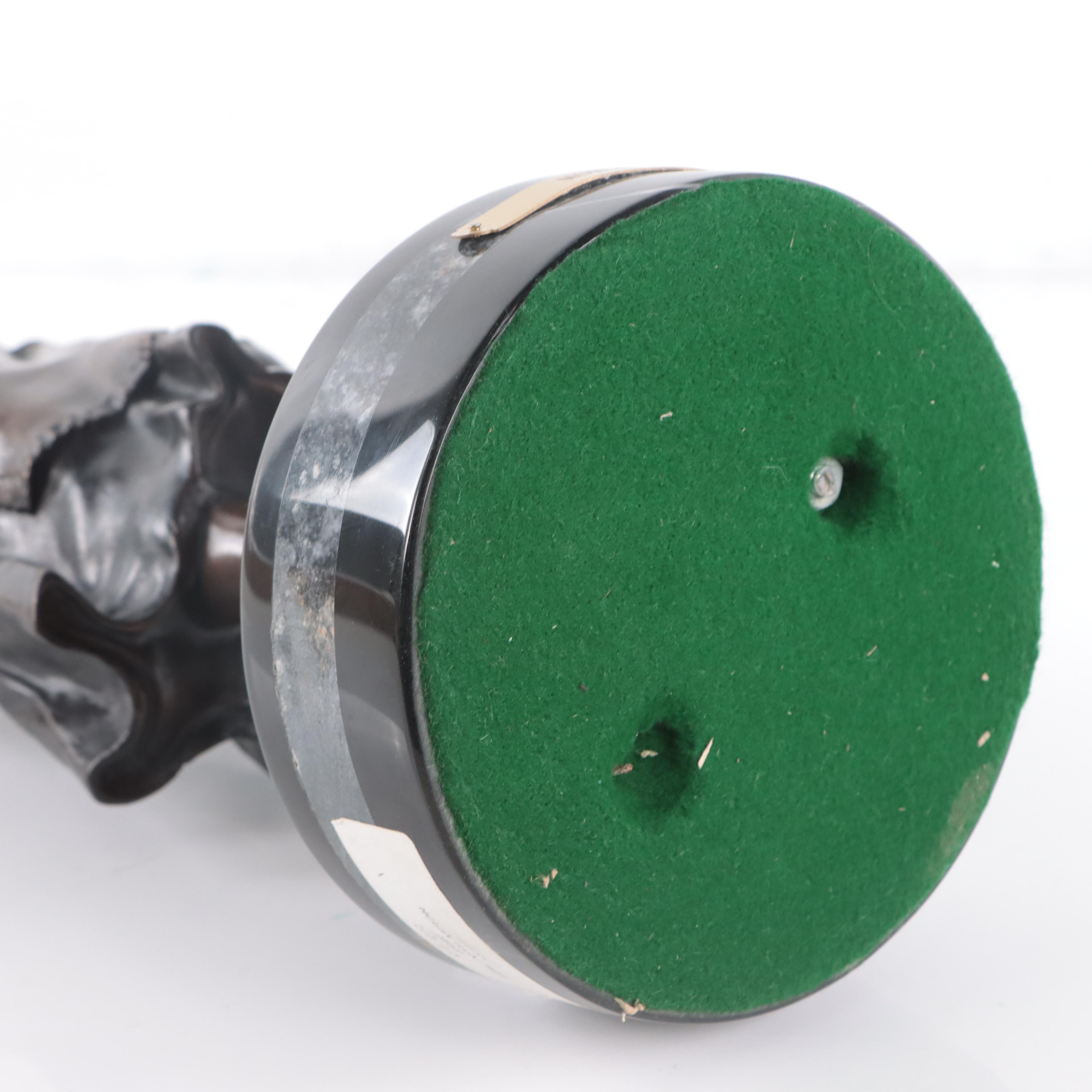 Bronze Sculpture of Woman Holding Flowers