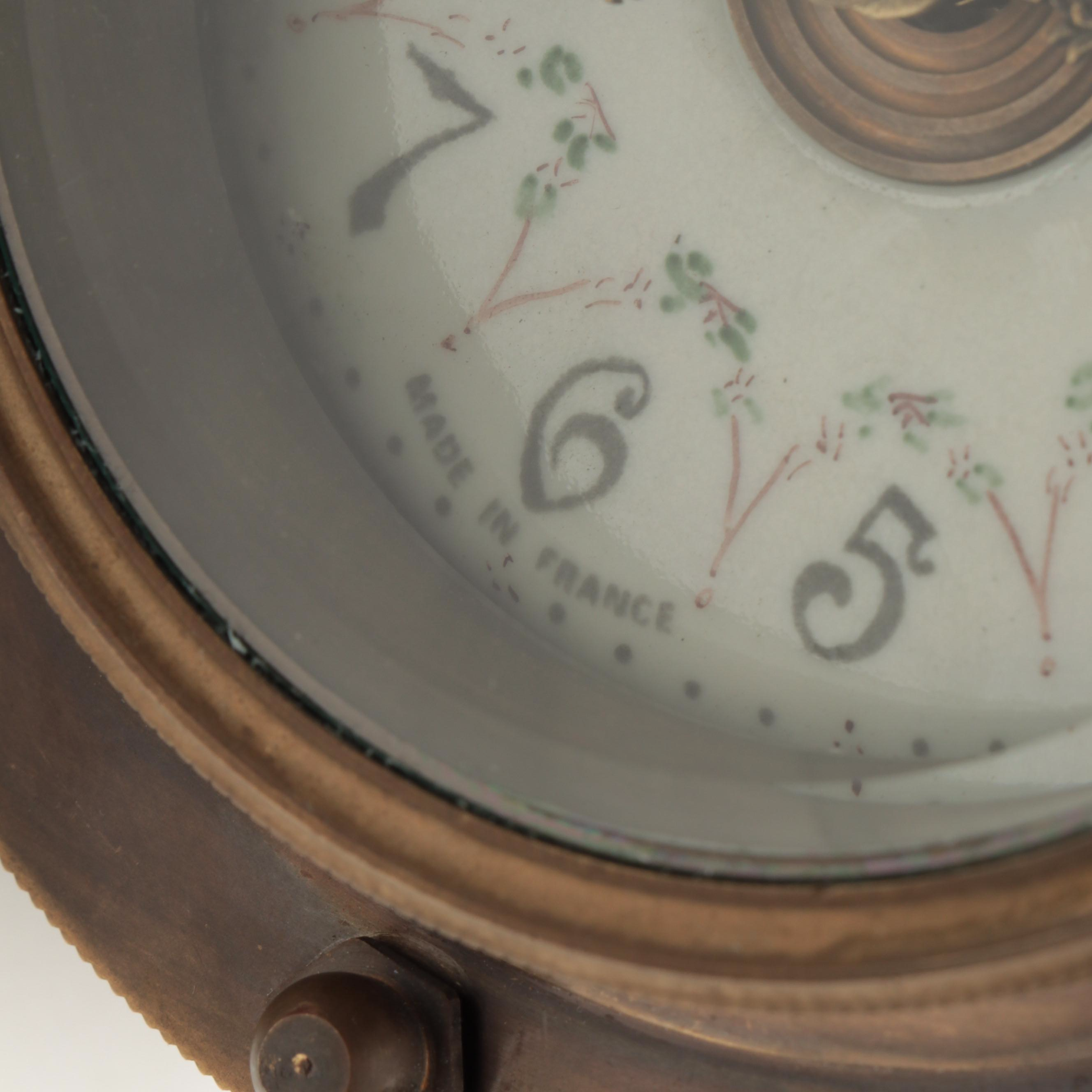 French Porcelain and Brass Incline Plane Rolling Clock with Stand