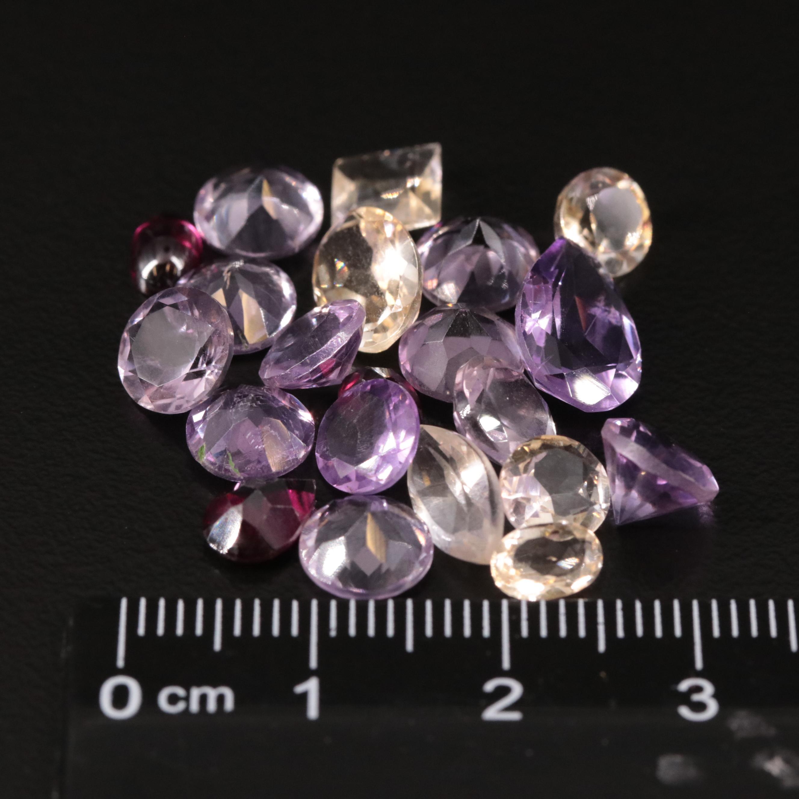 Loose 21.71 CTW Amethyst, Citrine, and Garnet Lot