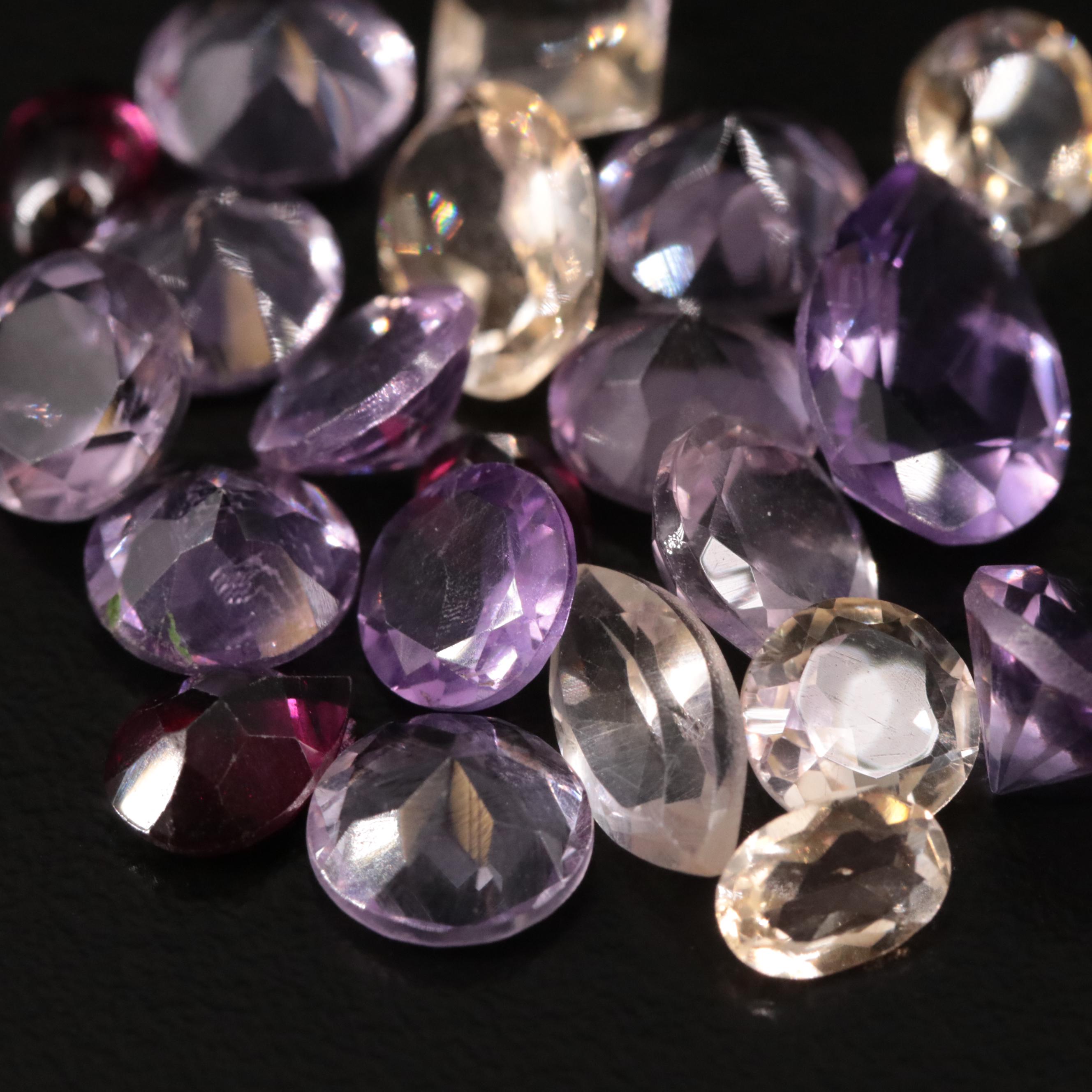 Loose 21.71 CTW Amethyst, Citrine, and Garnet Lot