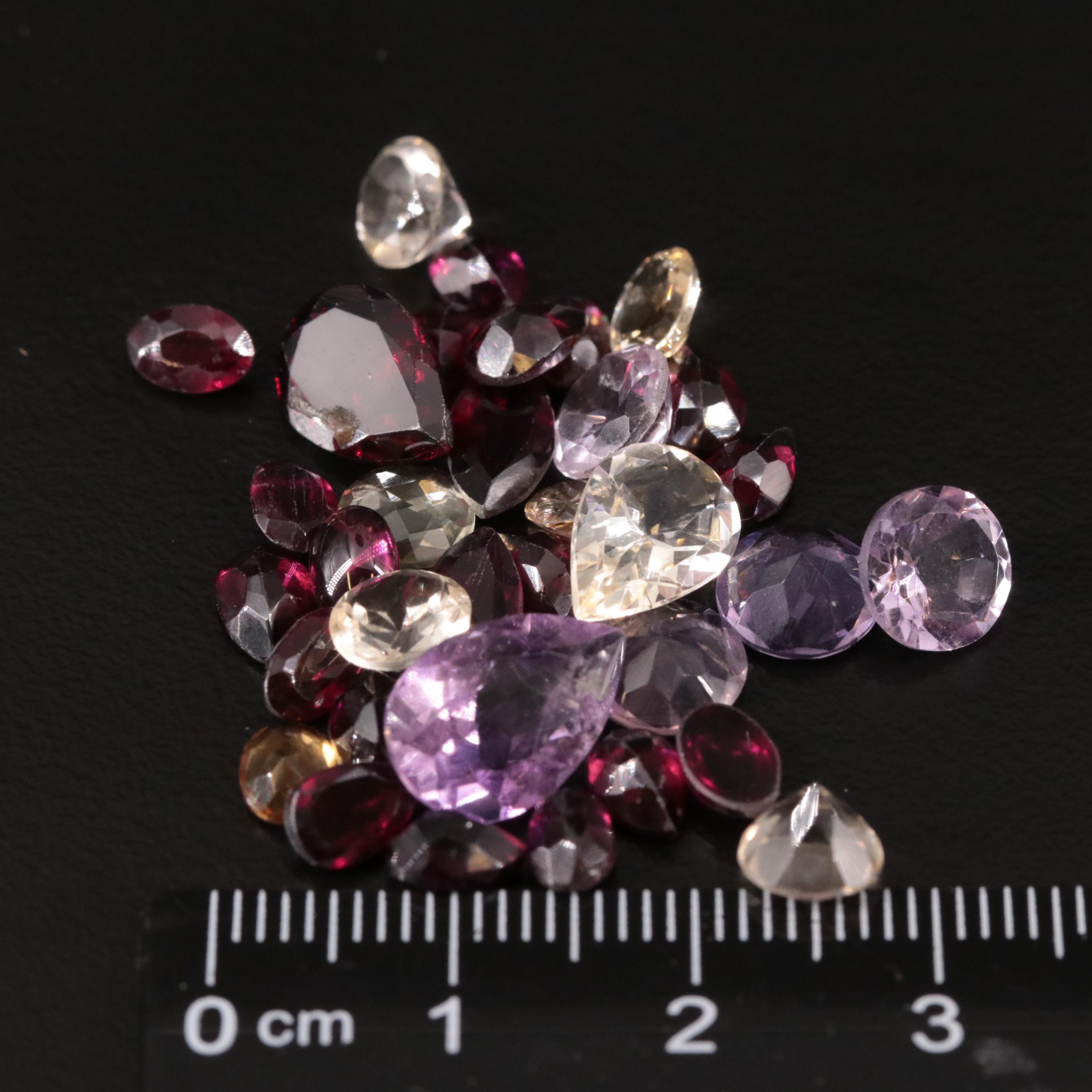 Loose 27.44 CTW Amethyst, Citrine, and Garnet Lot