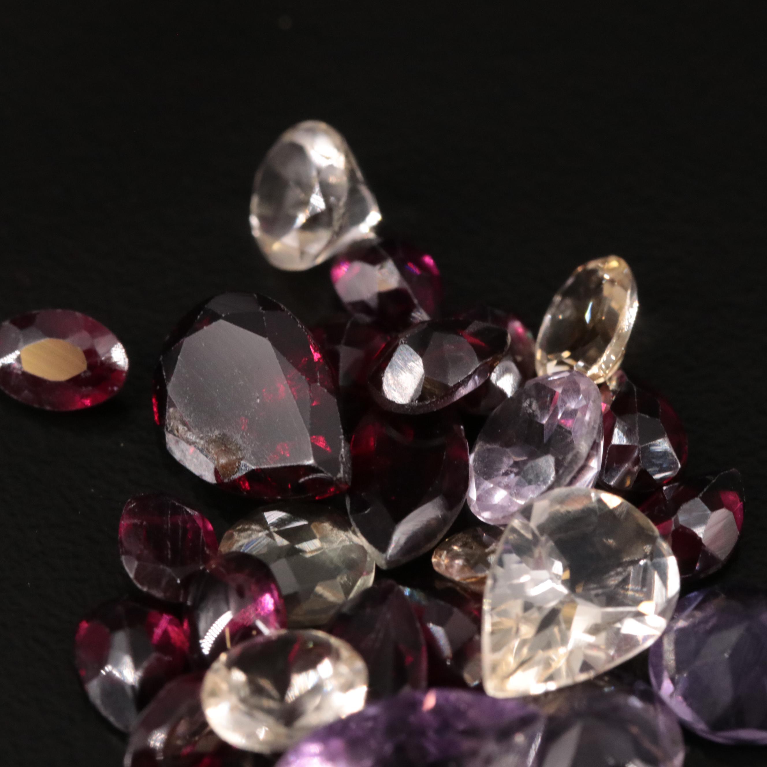 Loose 27.44 CTW Amethyst, Citrine, and Garnet Lot
