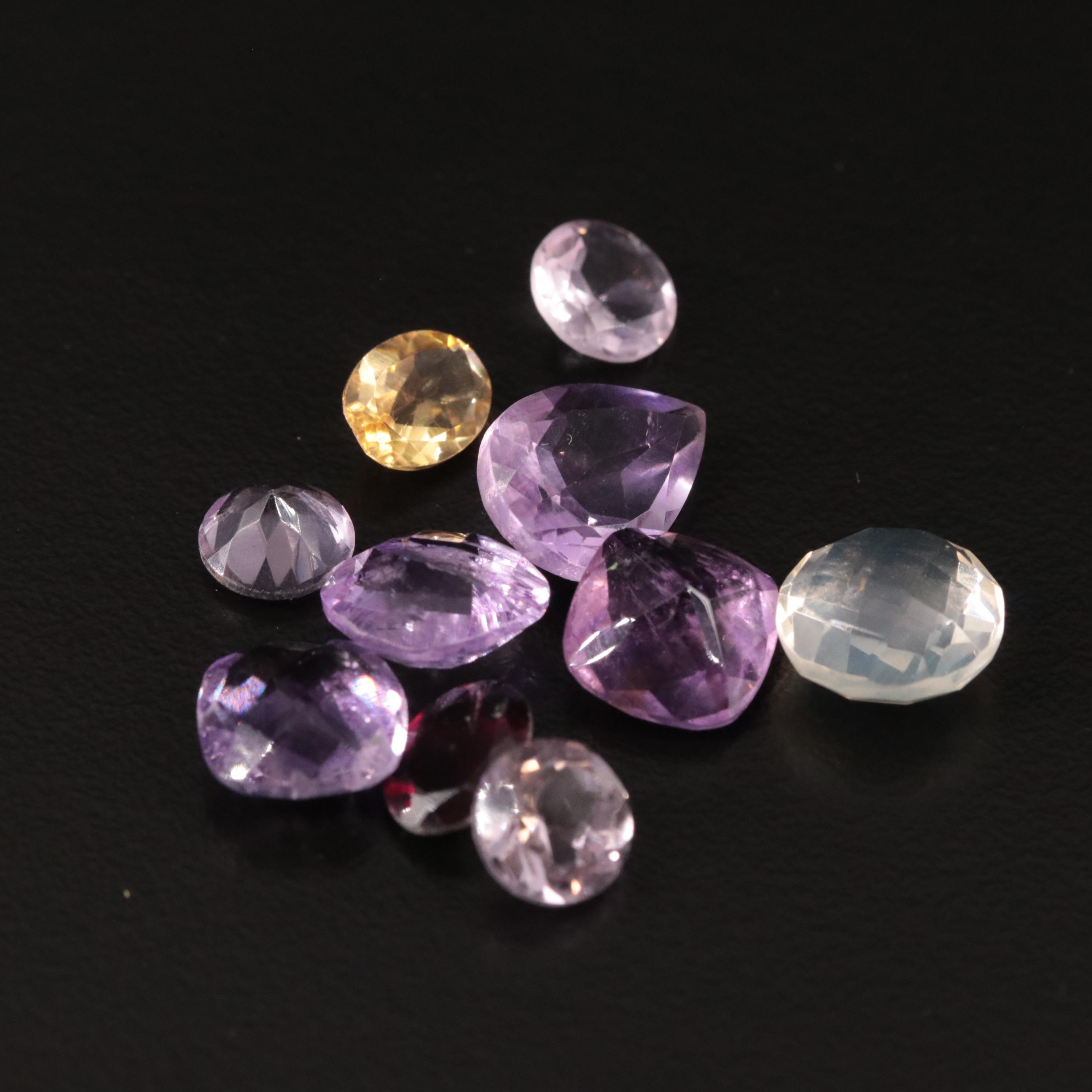 Loose 20.97 CTW Amethyst, Citrine, and Garnet Lot