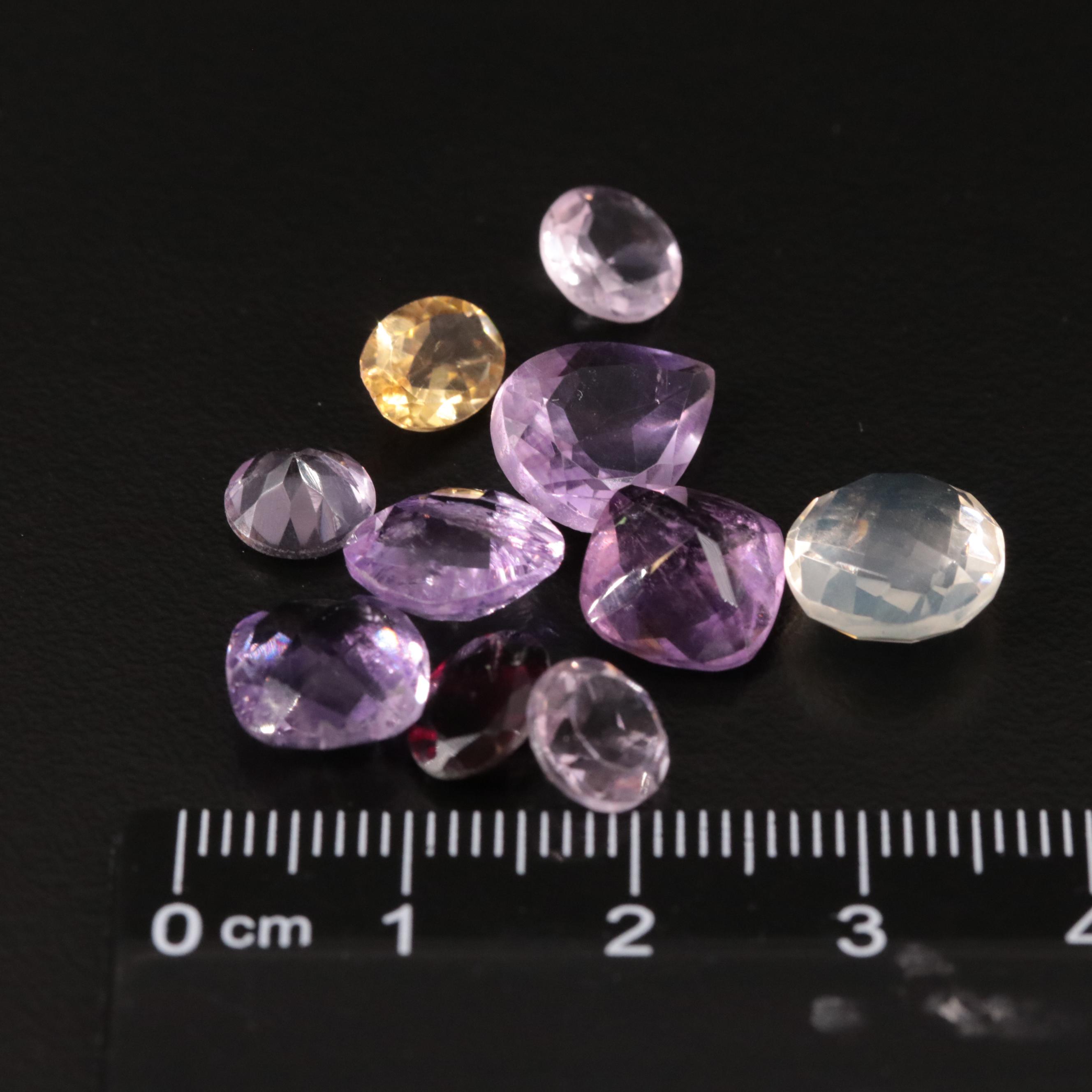 Loose 20.97 CTW Amethyst, Citrine, and Garnet Lot