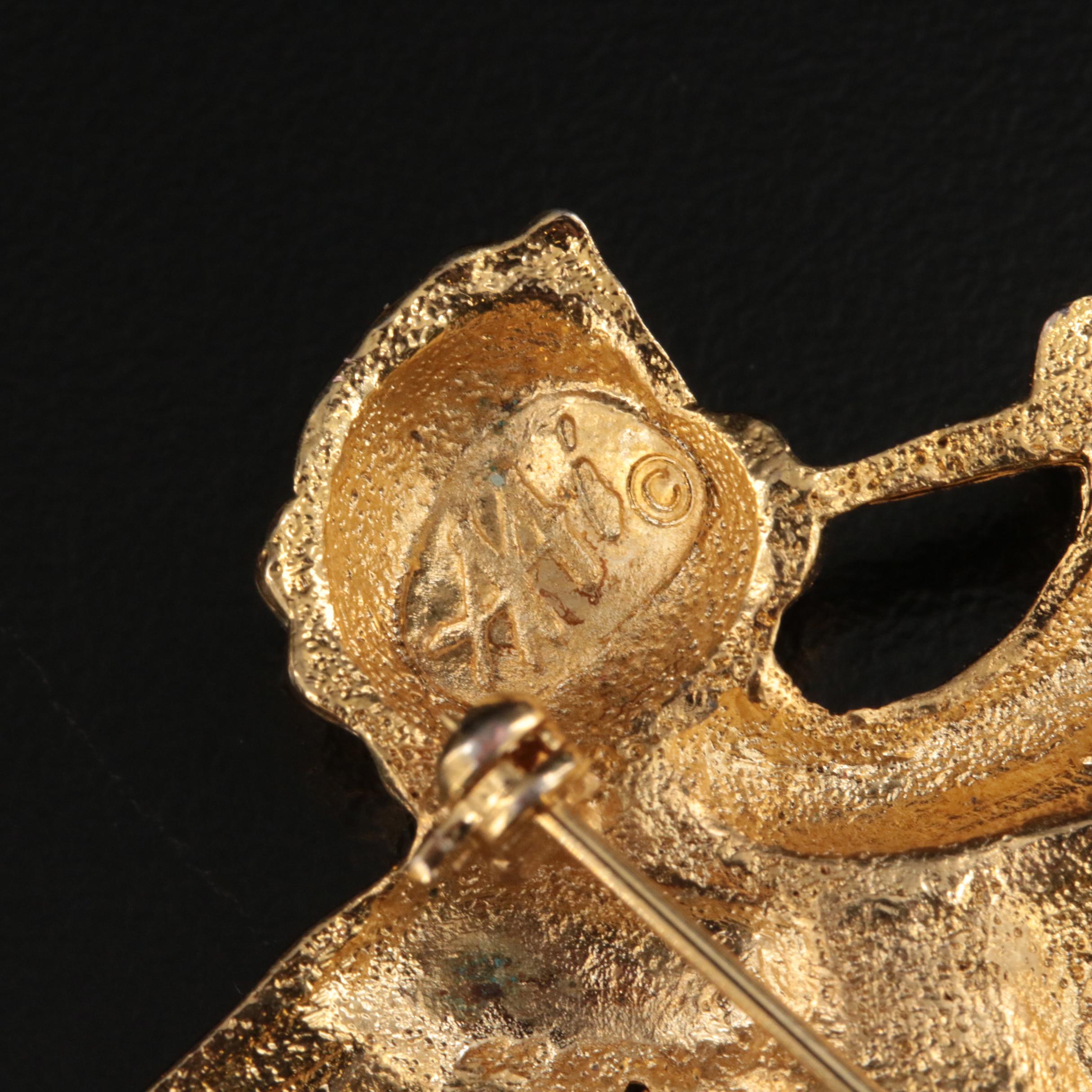 Vintage Brooches Including Man in the Moon and Celtic Knot