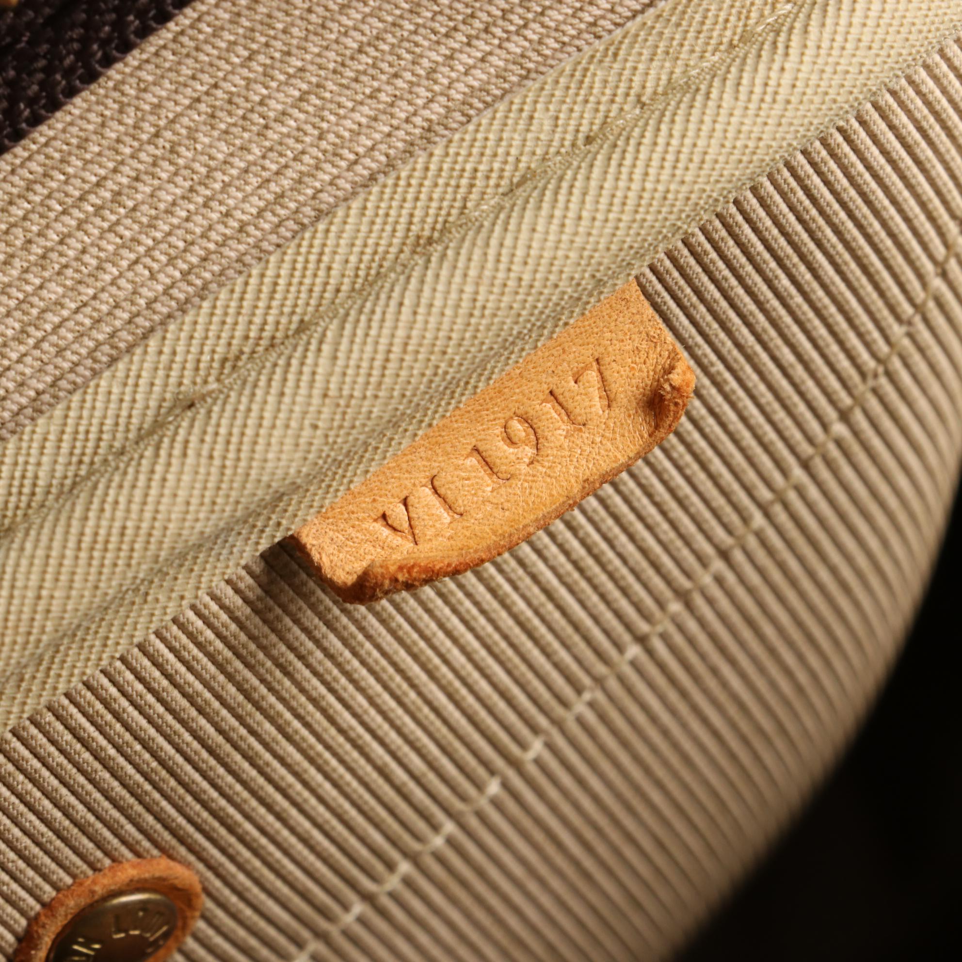 Louis Vuitton Evasion Travel Bag in Monogram Canvas and Vachetta Leather