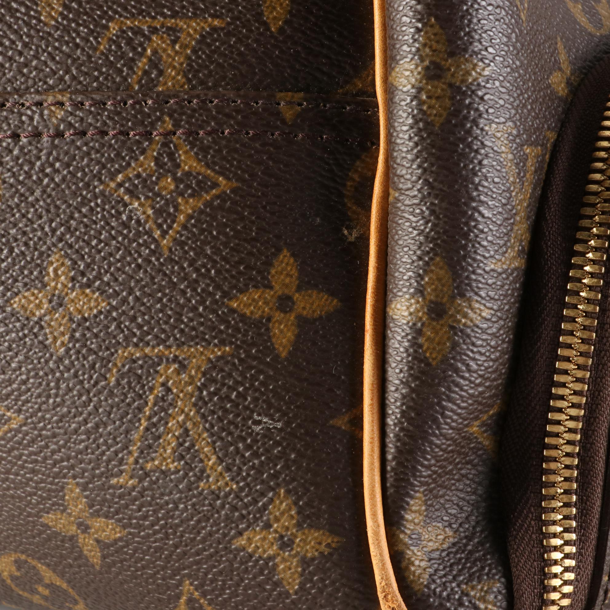 Louis Vuitton Evasion Travel Bag in Monogram Canvas and Vachetta Leather