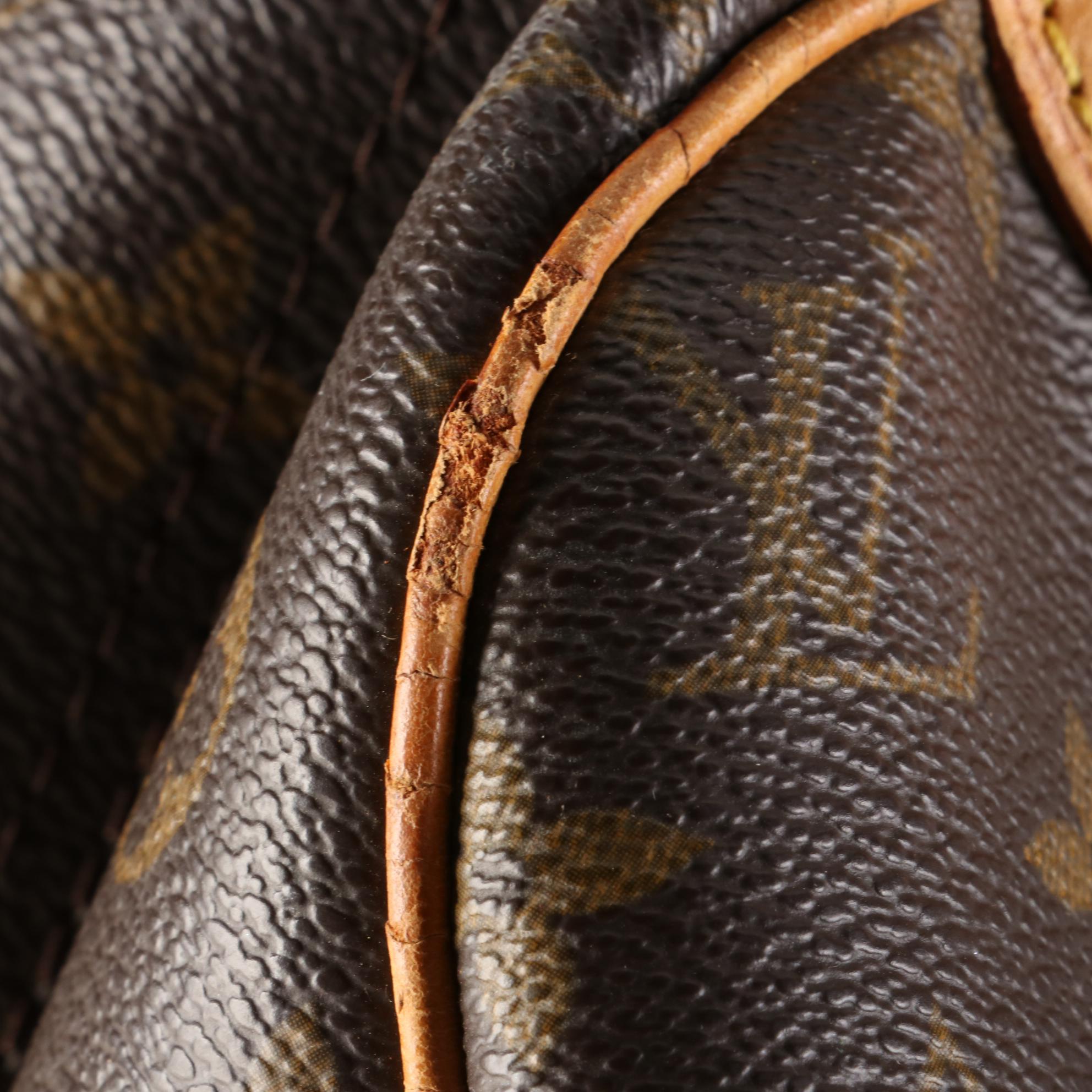 Louis Vuitton Evasion Travel Bag in Monogram Canvas and Vachetta Leather