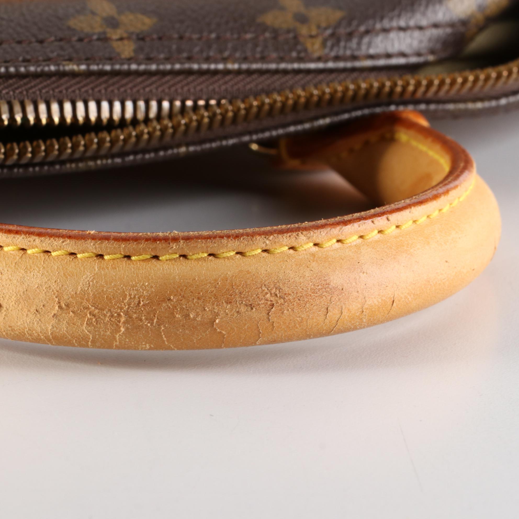 Louis Vuitton Evasion Travel Bag in Monogram Canvas and Vachetta Leather