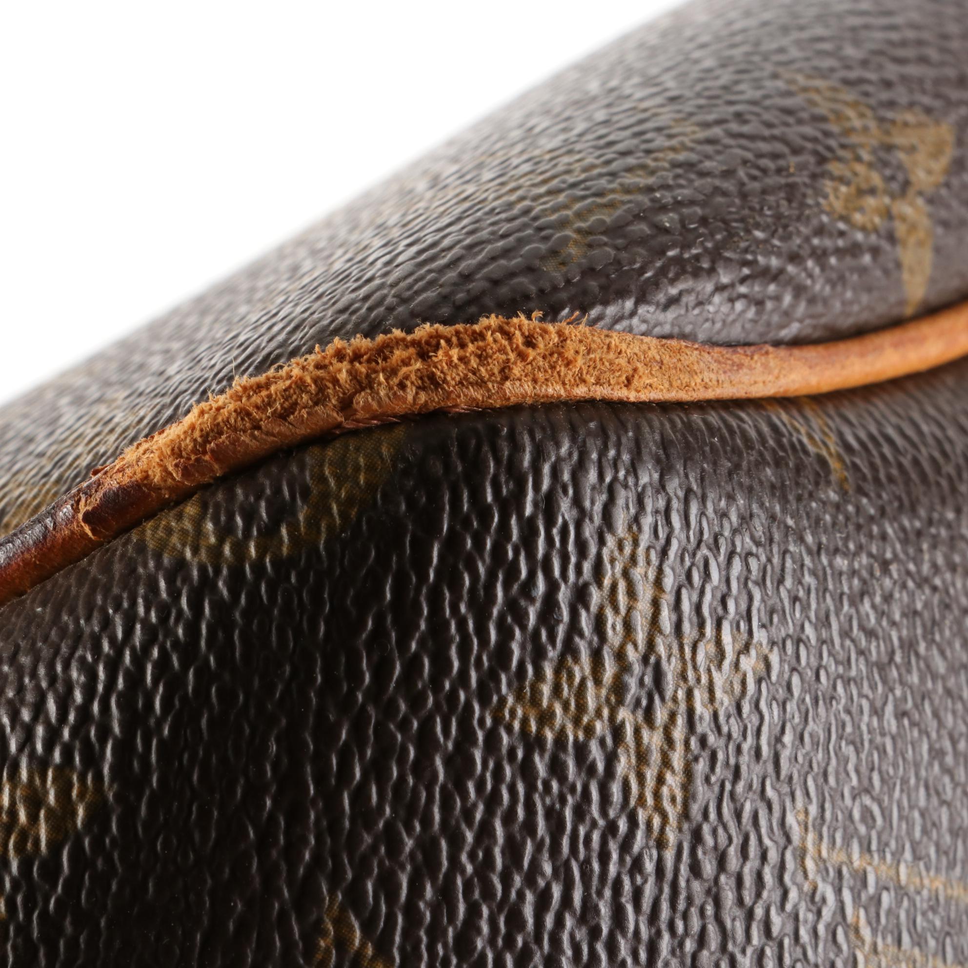 Louis Vuitton Evasion Travel Bag in Monogram Canvas and Vachetta Leather