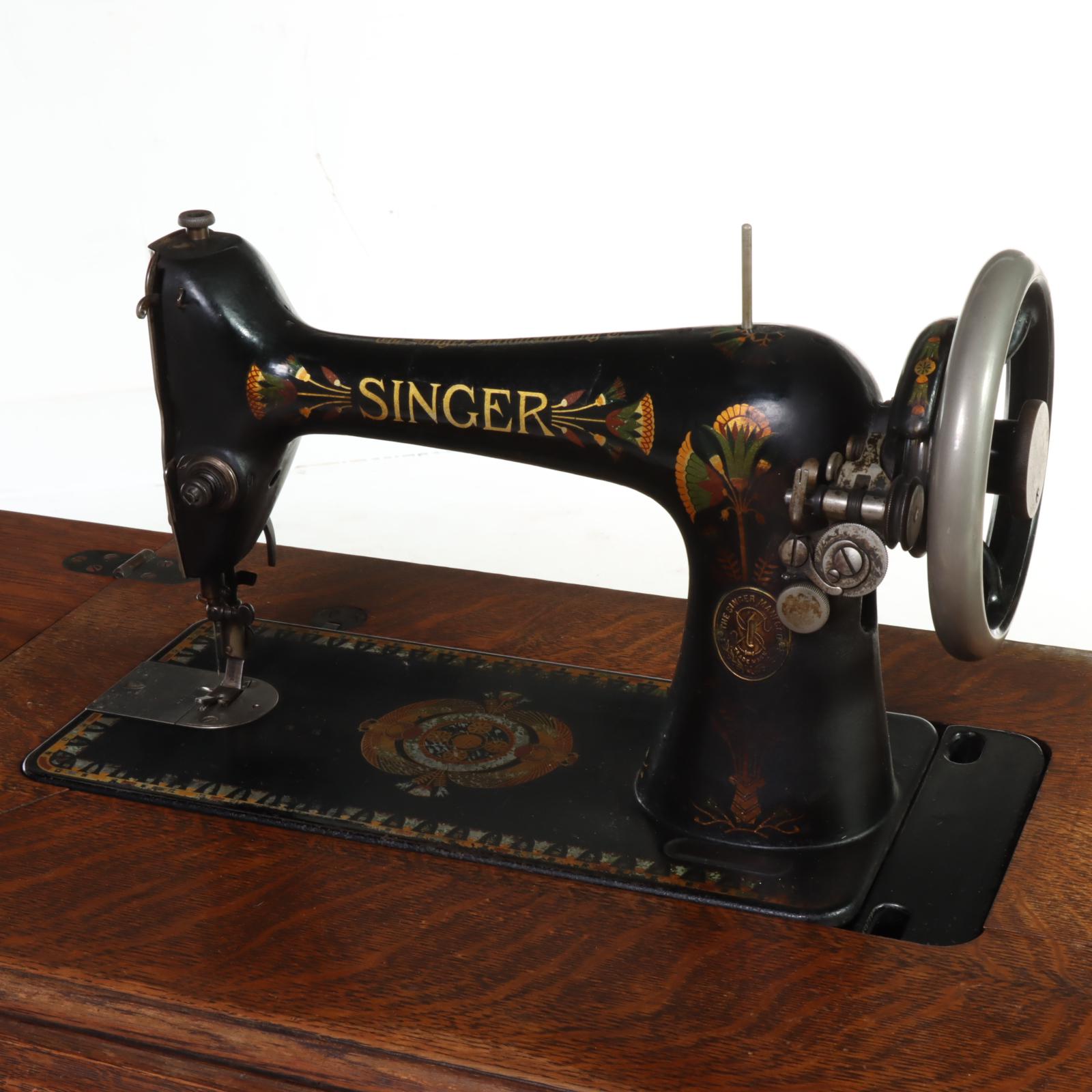 Singer Treadle-Wheel Sewing Machine with Oak and Iron Cabinet, Early 20th C.