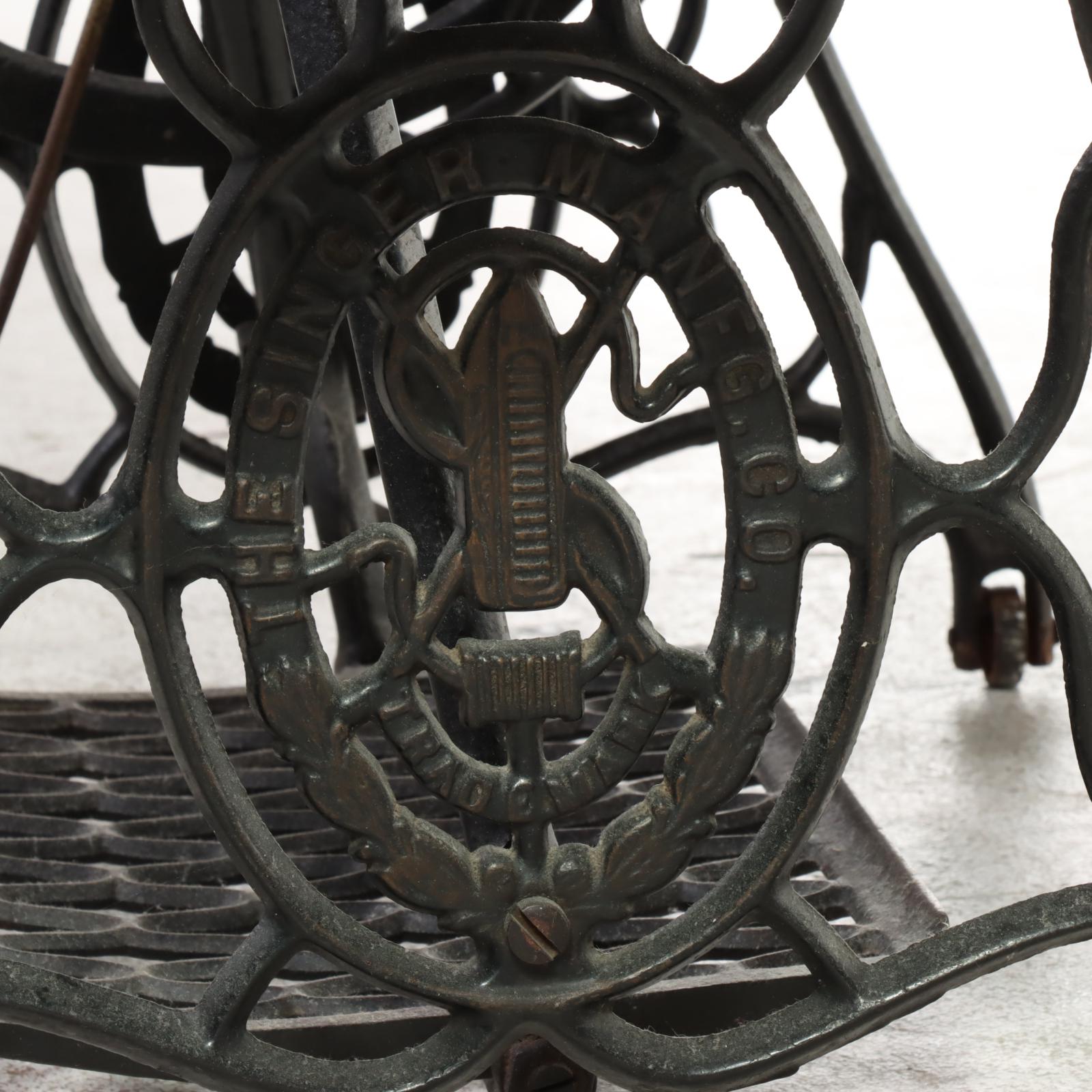 Singer Treadle-Wheel Sewing Machine with Oak and Iron Cabinet, Early 20th C.