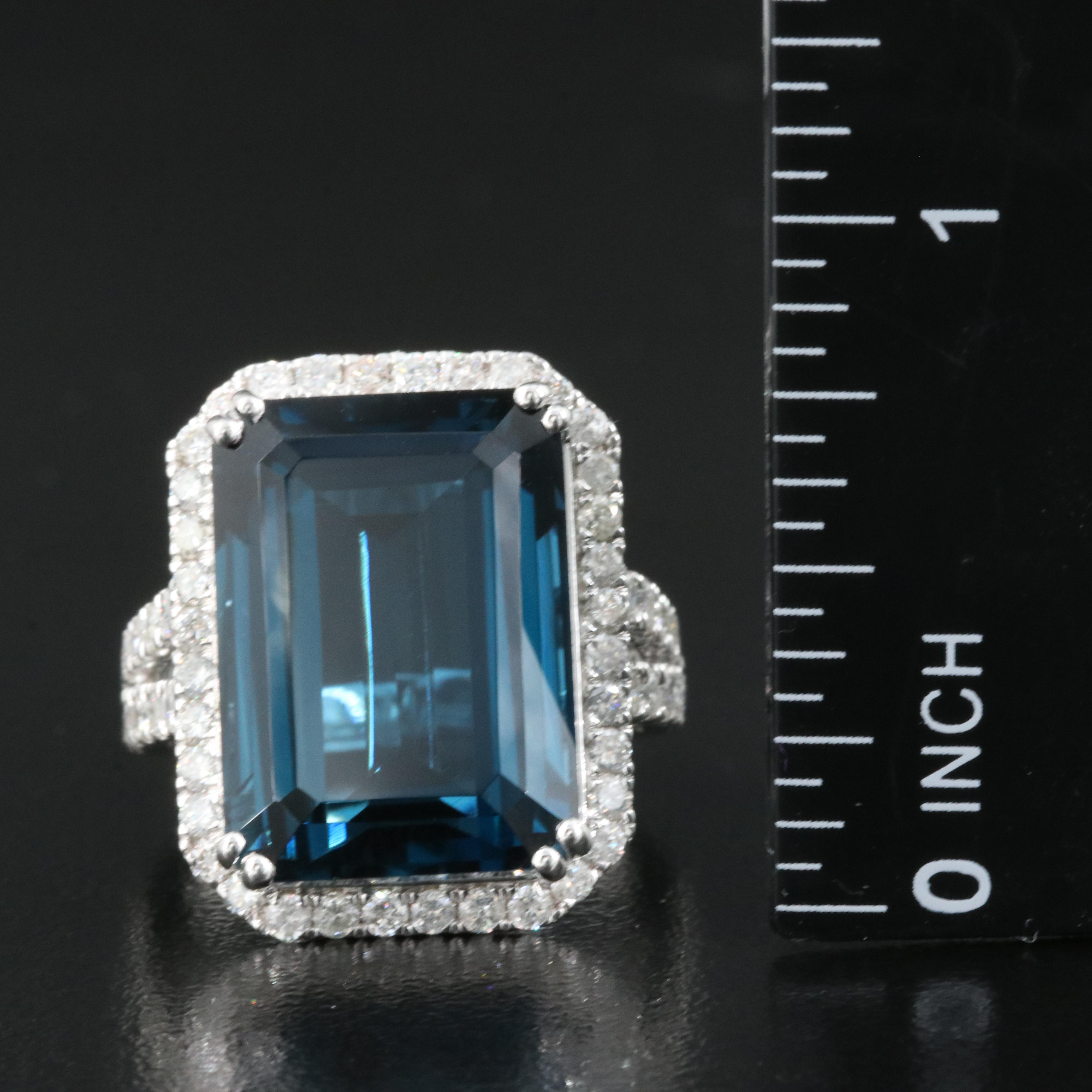 14K 21.18 CT London Blue Topaz and 1.35 CTW Diamond Halo Ring