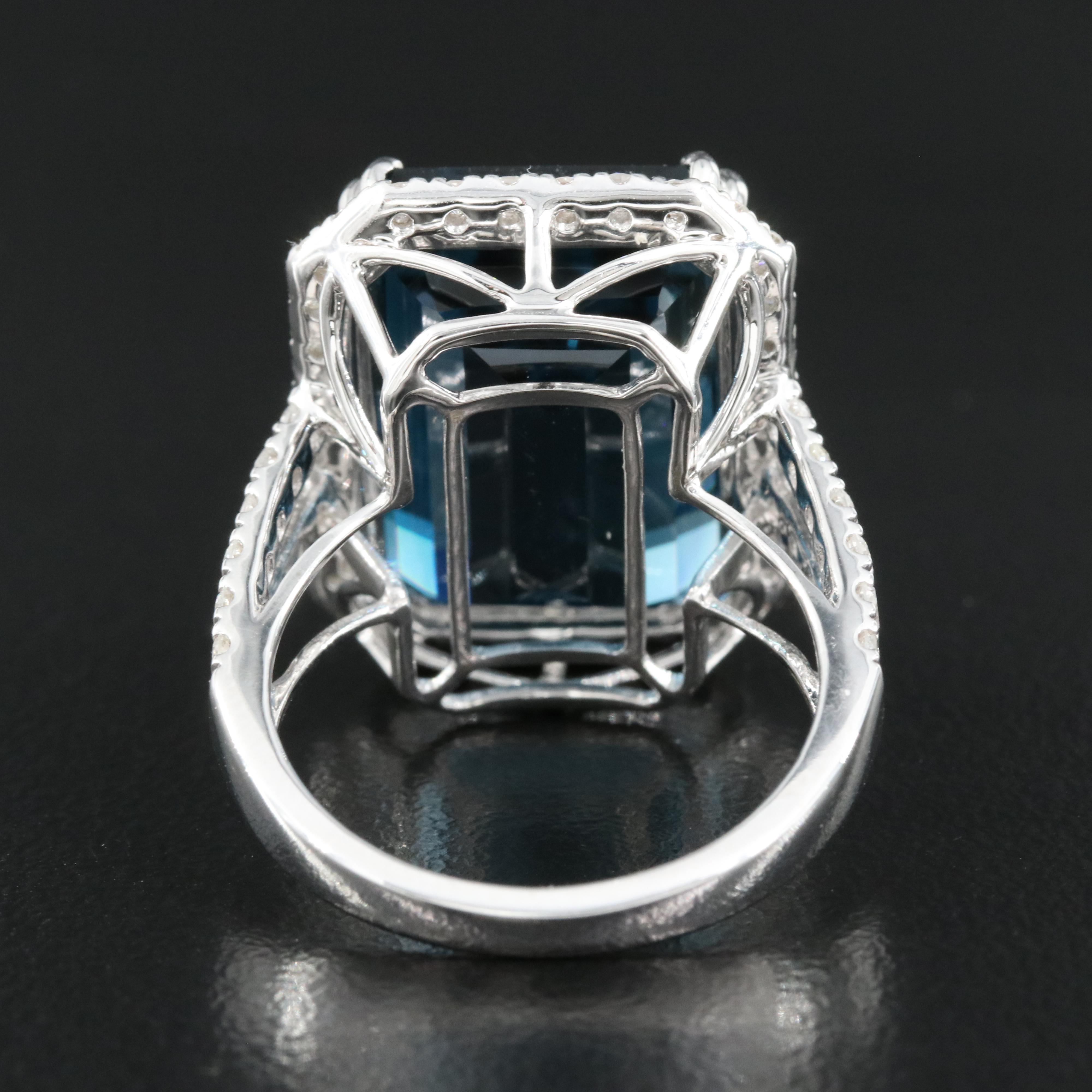 14K 21.18 CT London Blue Topaz and 1.35 CTW Diamond Halo Ring