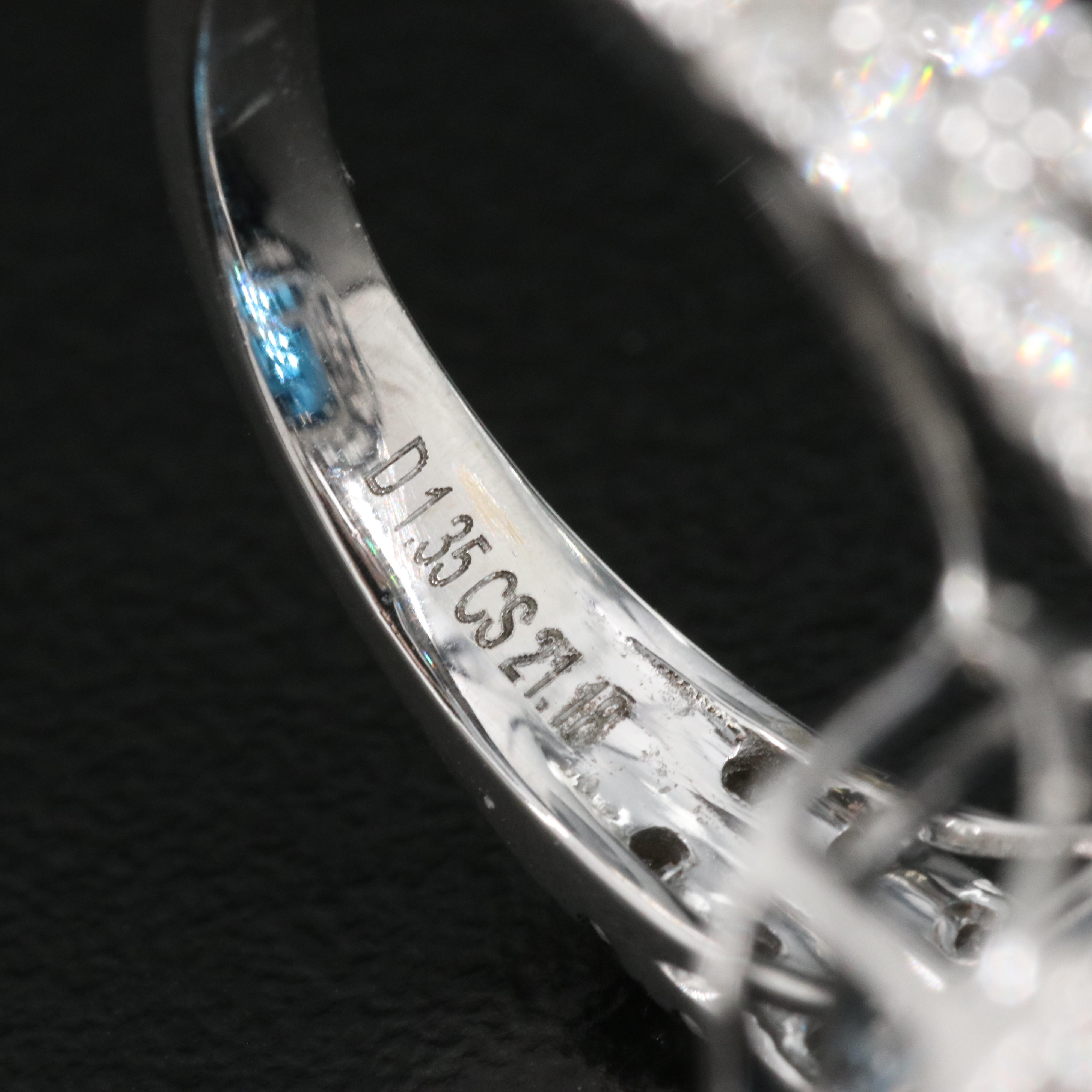 14K 21.18 CT London Blue Topaz and 1.35 CTW Diamond Halo Ring