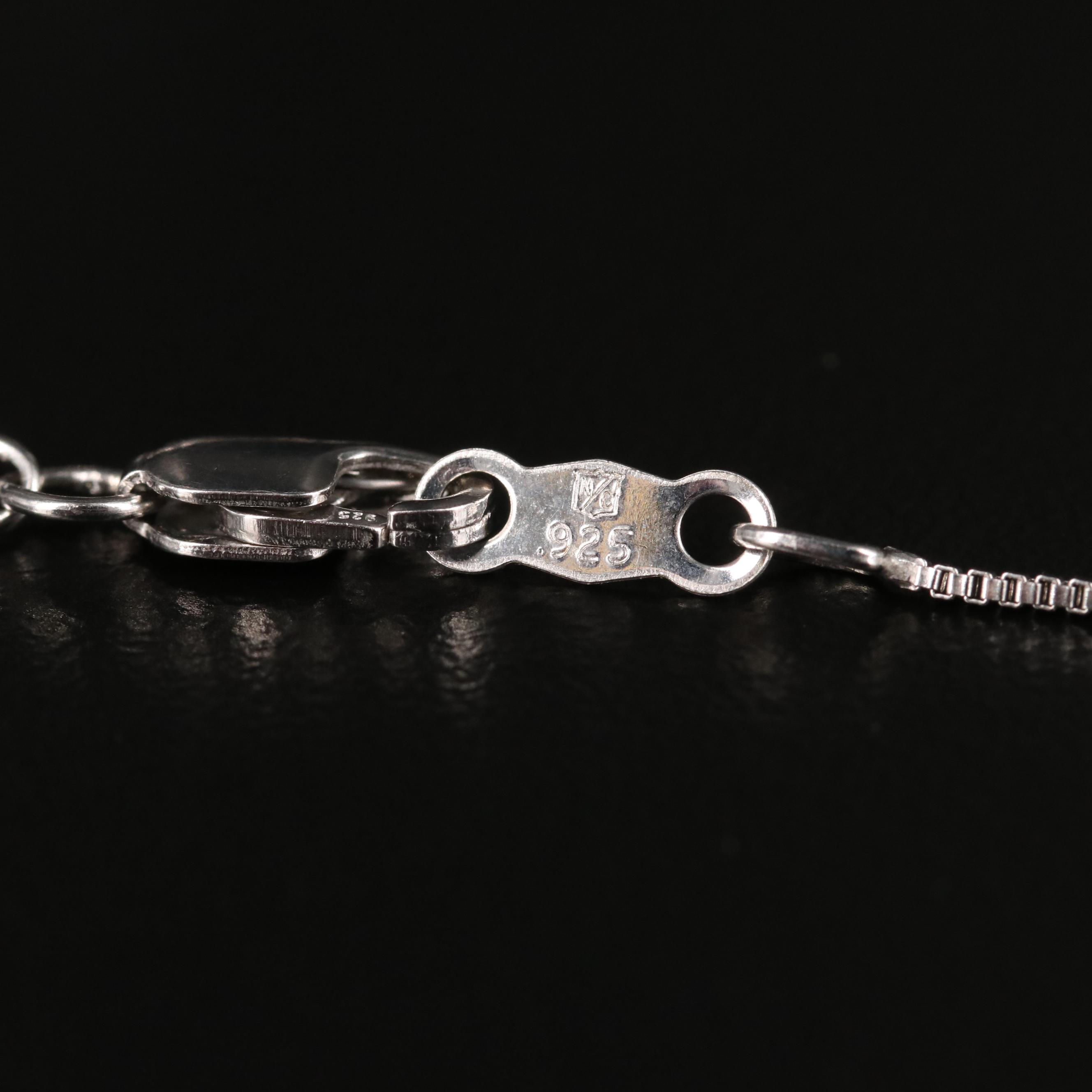 Sterling Ruby and Sapphire Articulated Flower in Heart Pendant Necklace