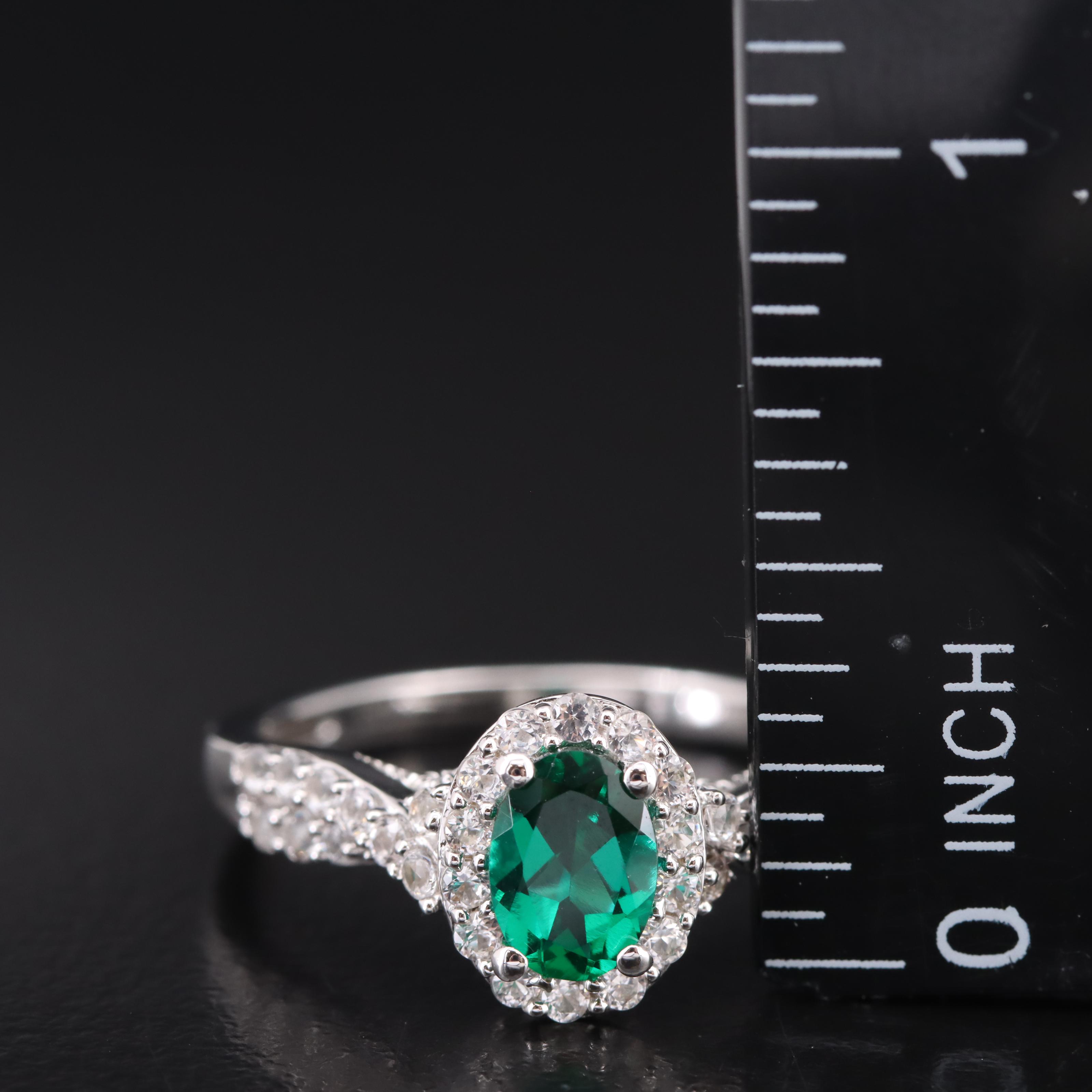 Sterling Emerald and Sapphire Halo Ring with Twist Shoulders