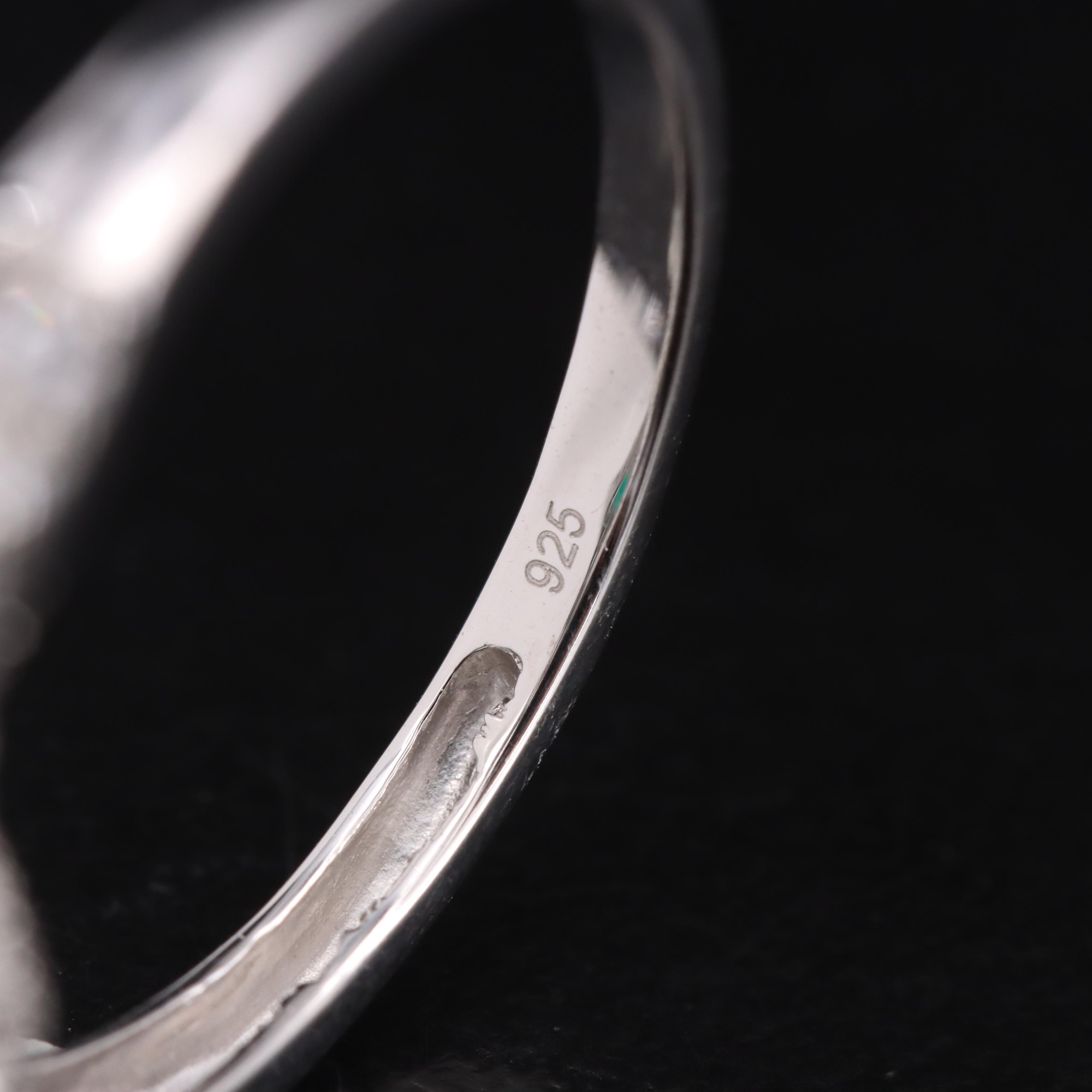 Sterling Emerald and Sapphire Halo Ring with Twist Shoulders