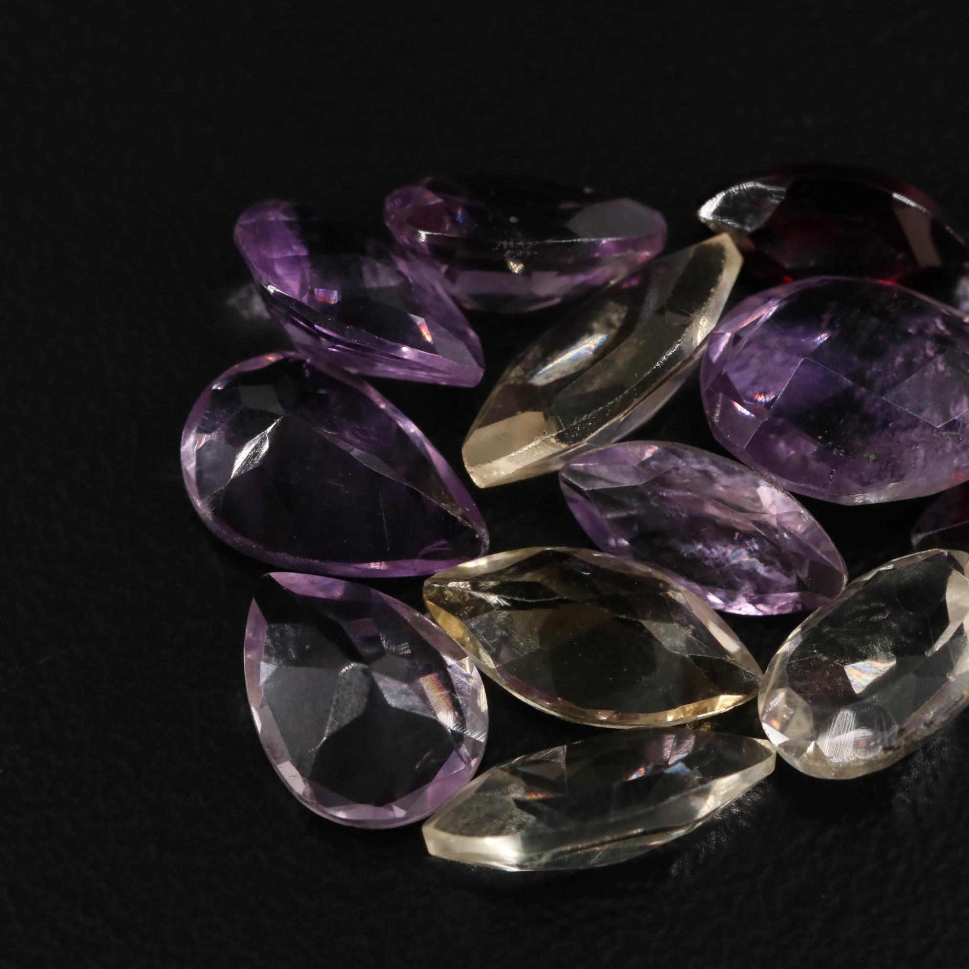 Loose 21.40 CTW Amethyst, Citrine, and Garnet Lot