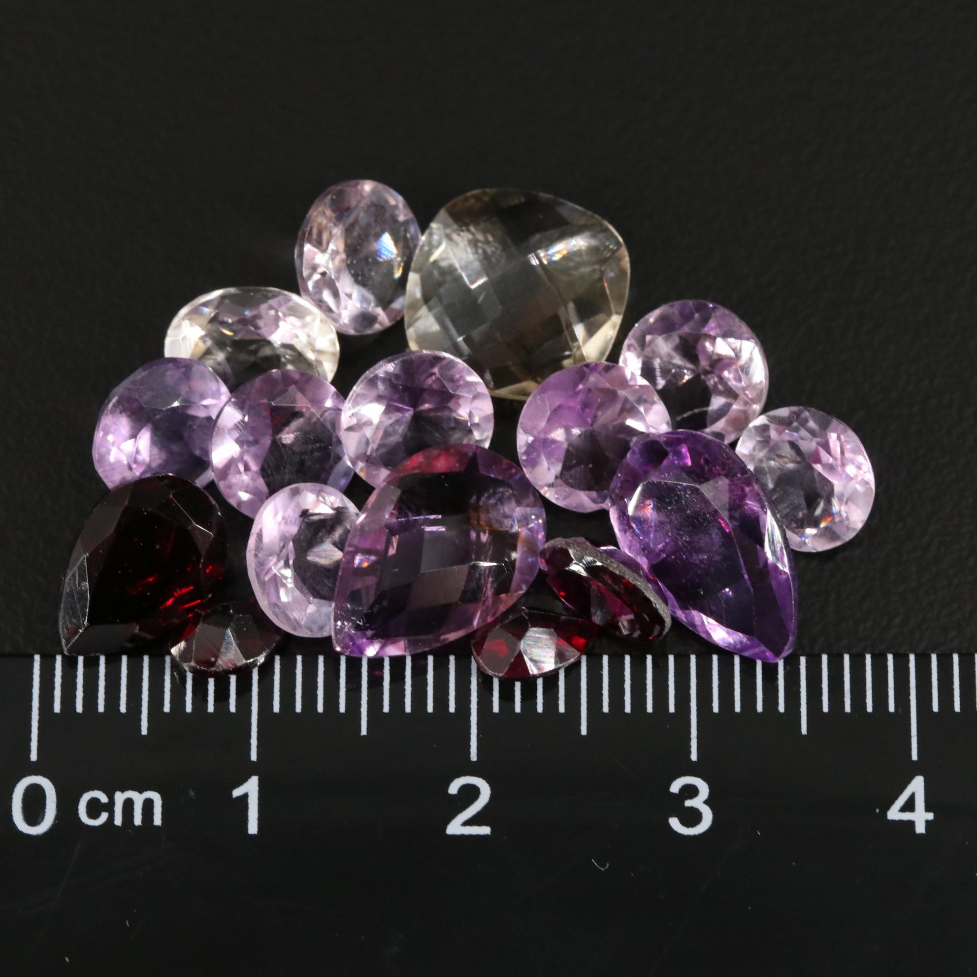 Loose 21.70 CTW Amethyst, Citrine, and Garnet Lot