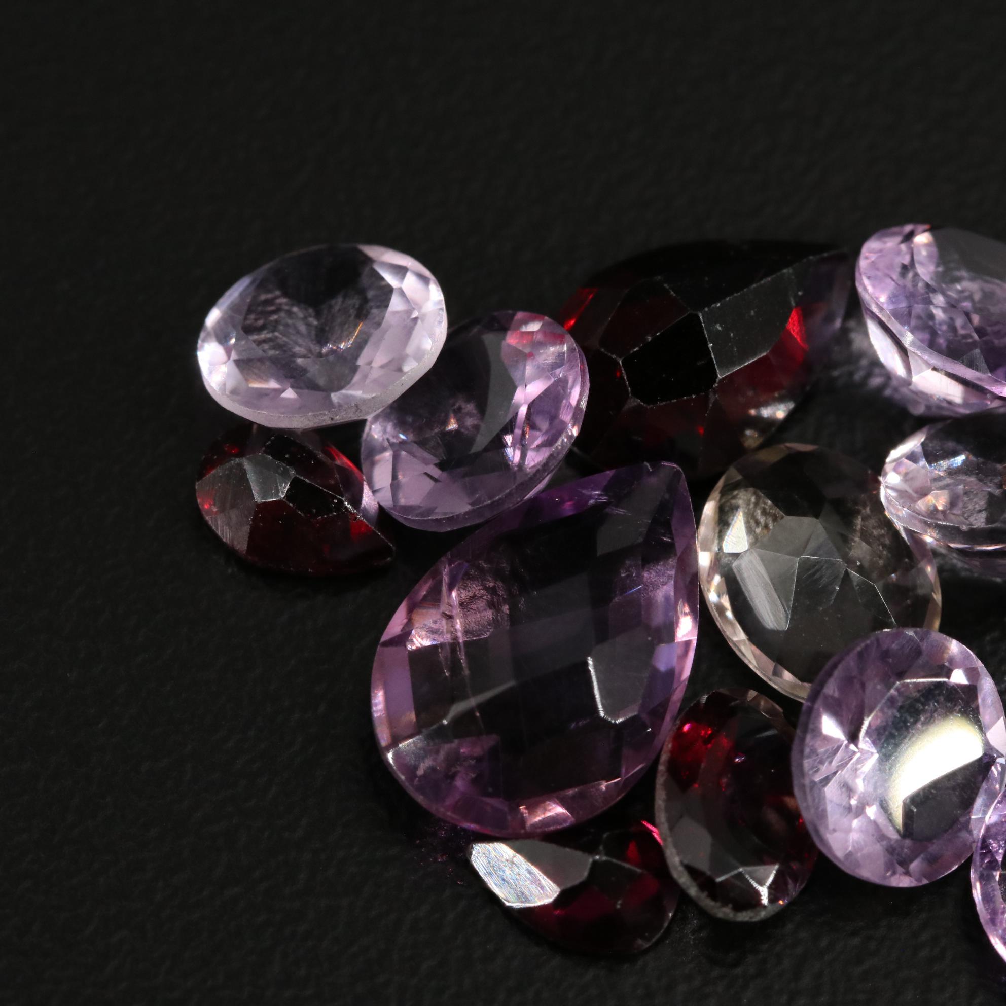 Loose 21.70 CTW Amethyst, Citrine, and Garnet Lot