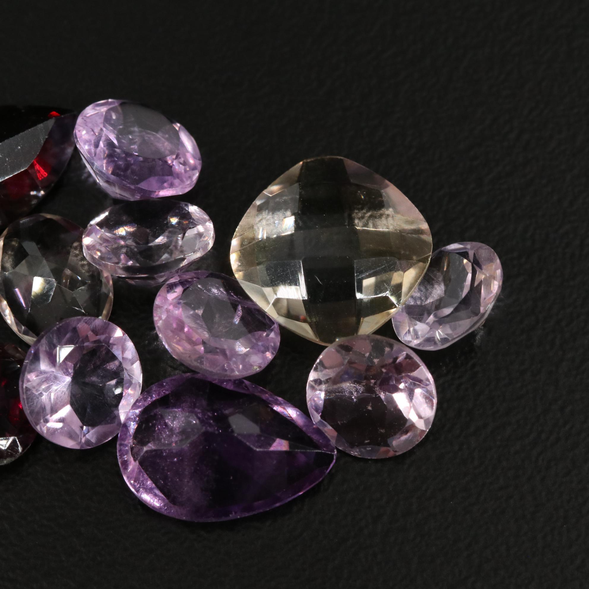 Loose 21.70 CTW Amethyst, Citrine, and Garnet Lot