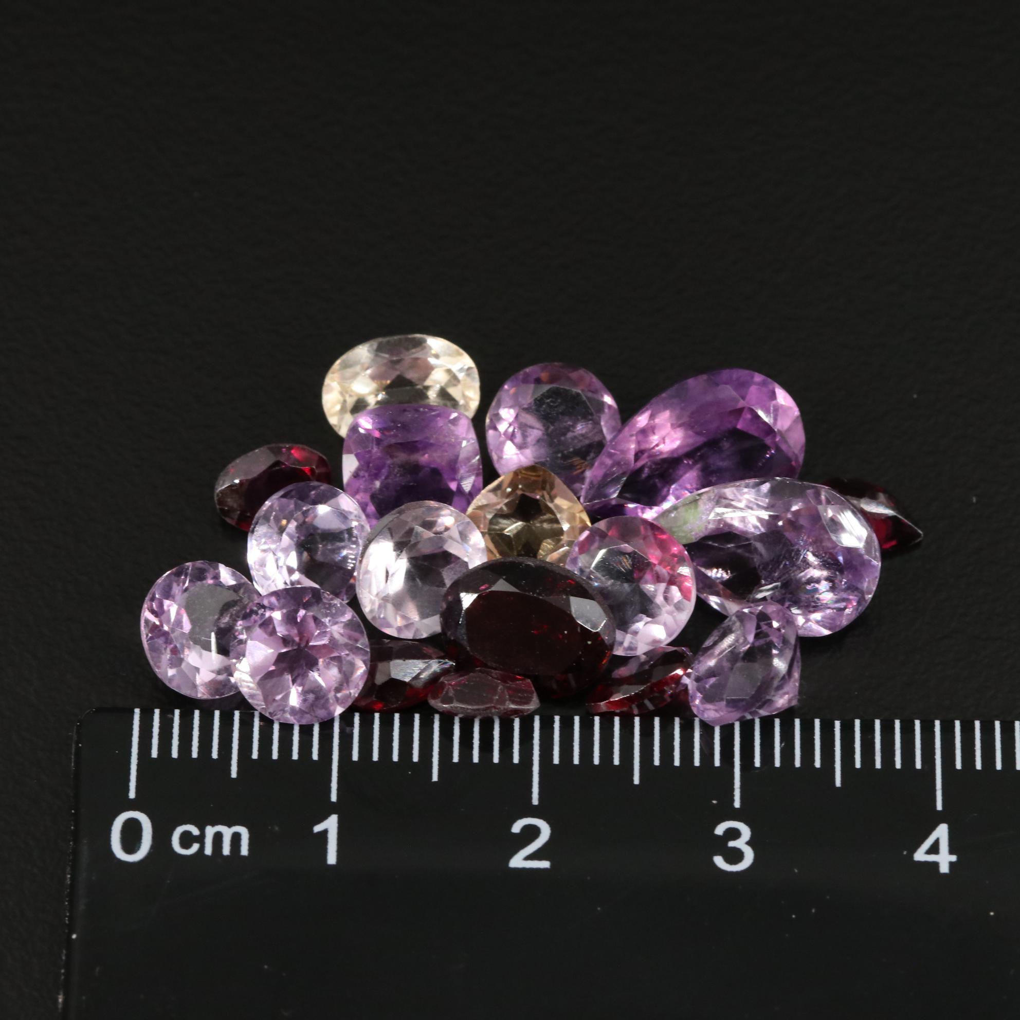 Loose 21.78 CTW Amethyst, Citrine, and Garnet Lot