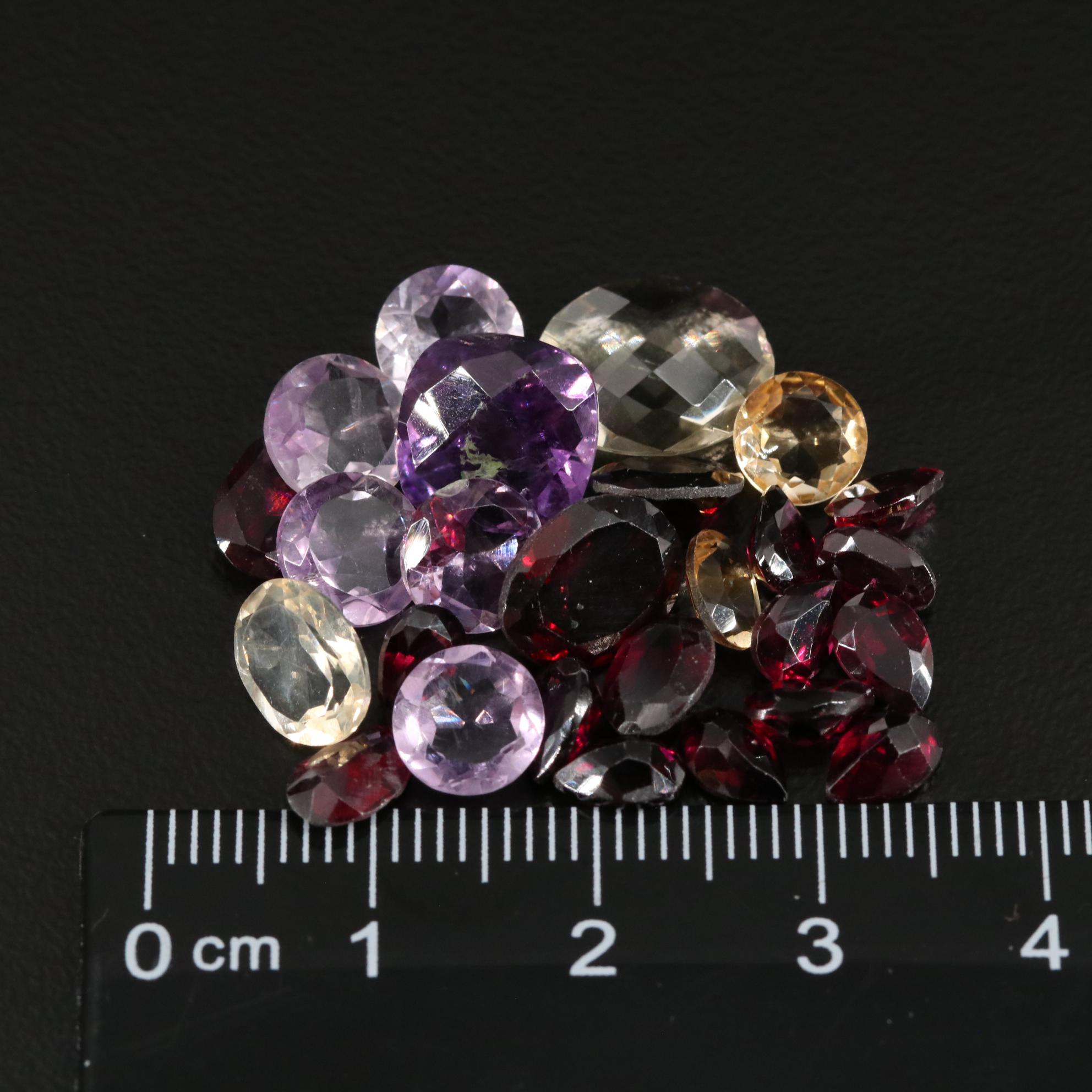 Loose 25.00 CTW Amethyst, Citrine, and Garnet Lot