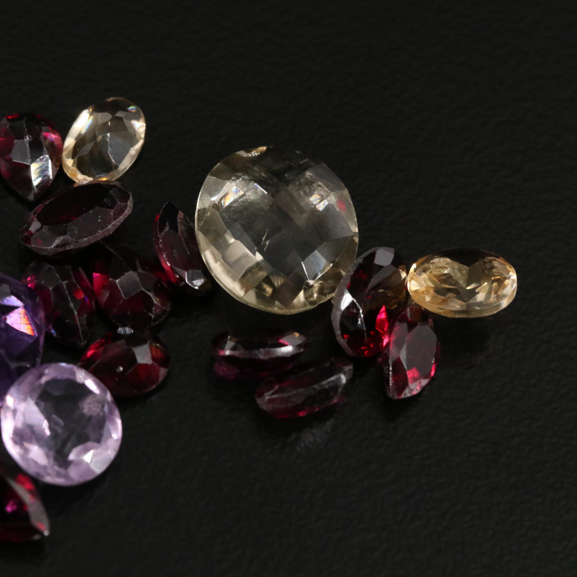 Loose 25.00 CTW Amethyst, Citrine, and Garnet Lot