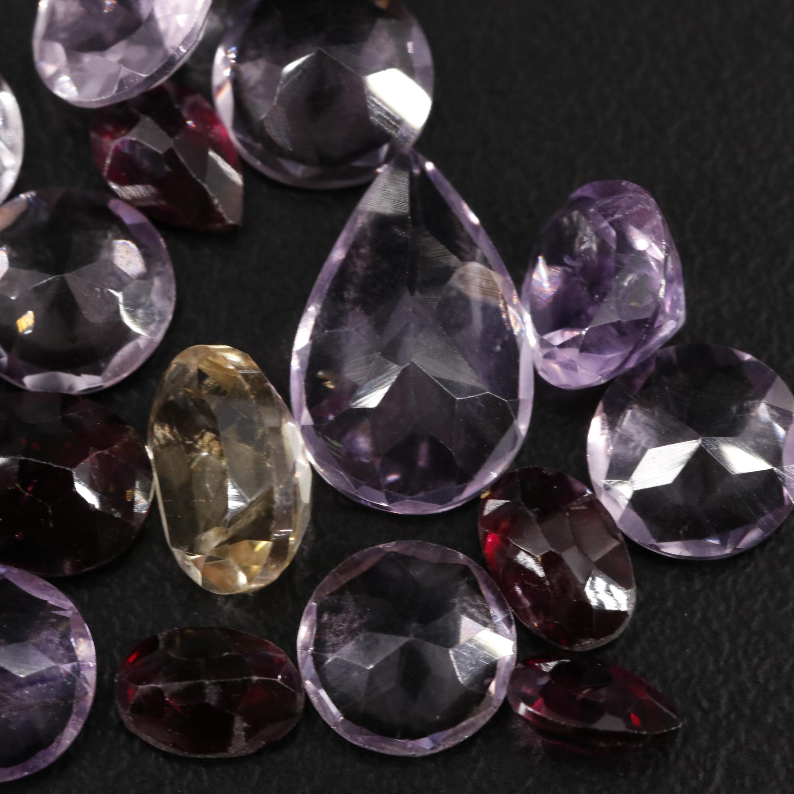 Loose 19.61 CTW Amethyst, Garnet, and Citrine Lot