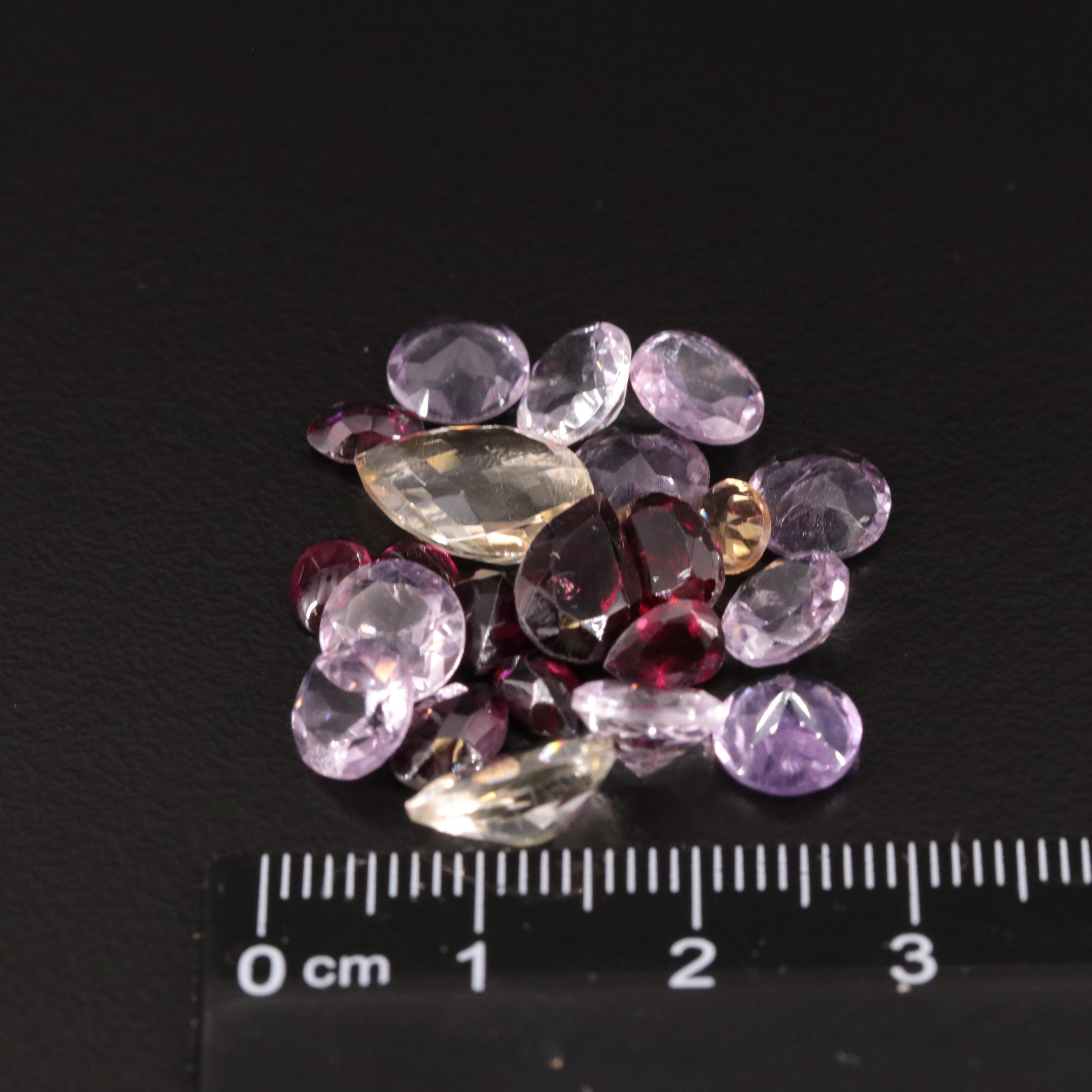Loose 21.10 CTW Amethyst, Citrine, and Garnet Lot
