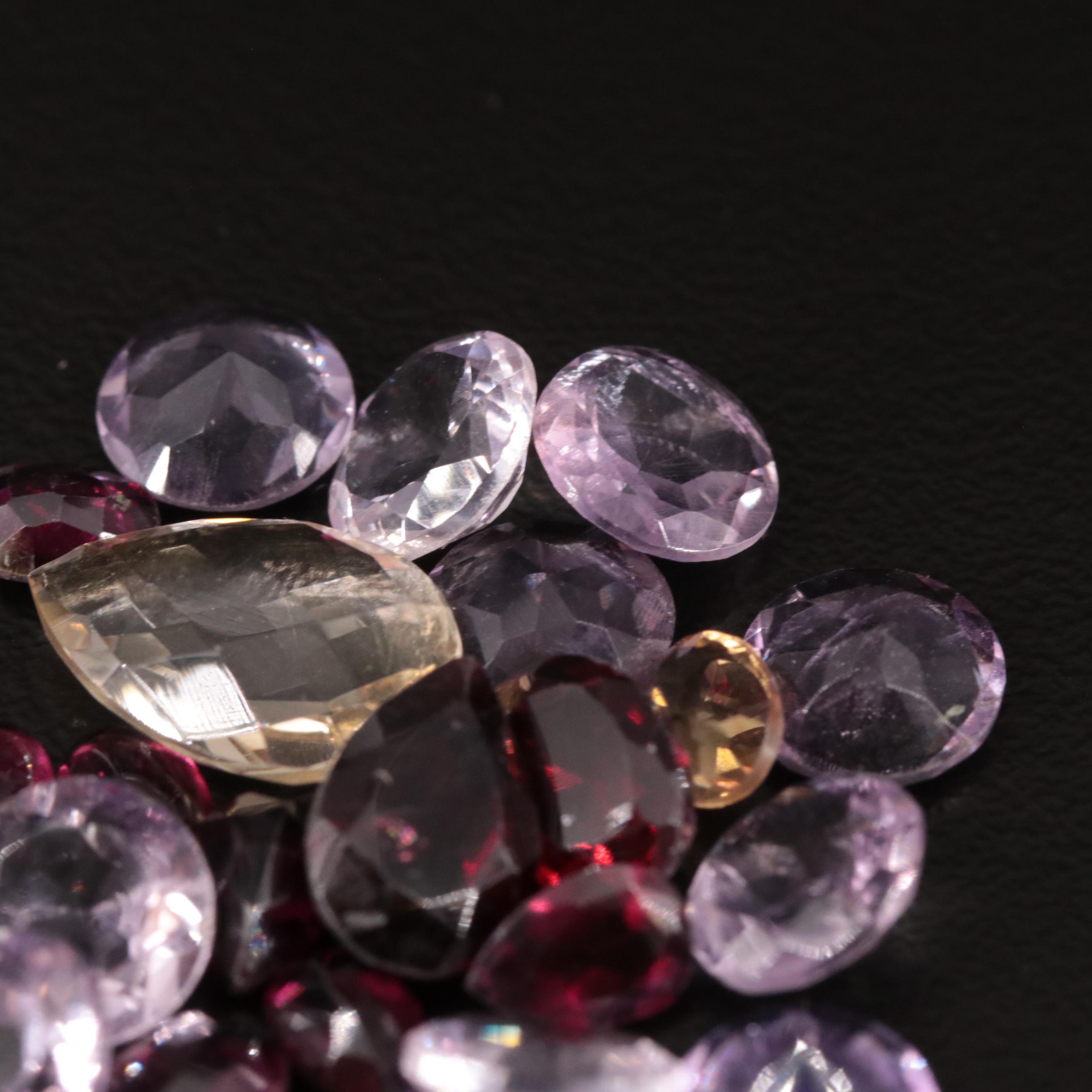 Loose 21.10 CTW Amethyst, Citrine, and Garnet Lot