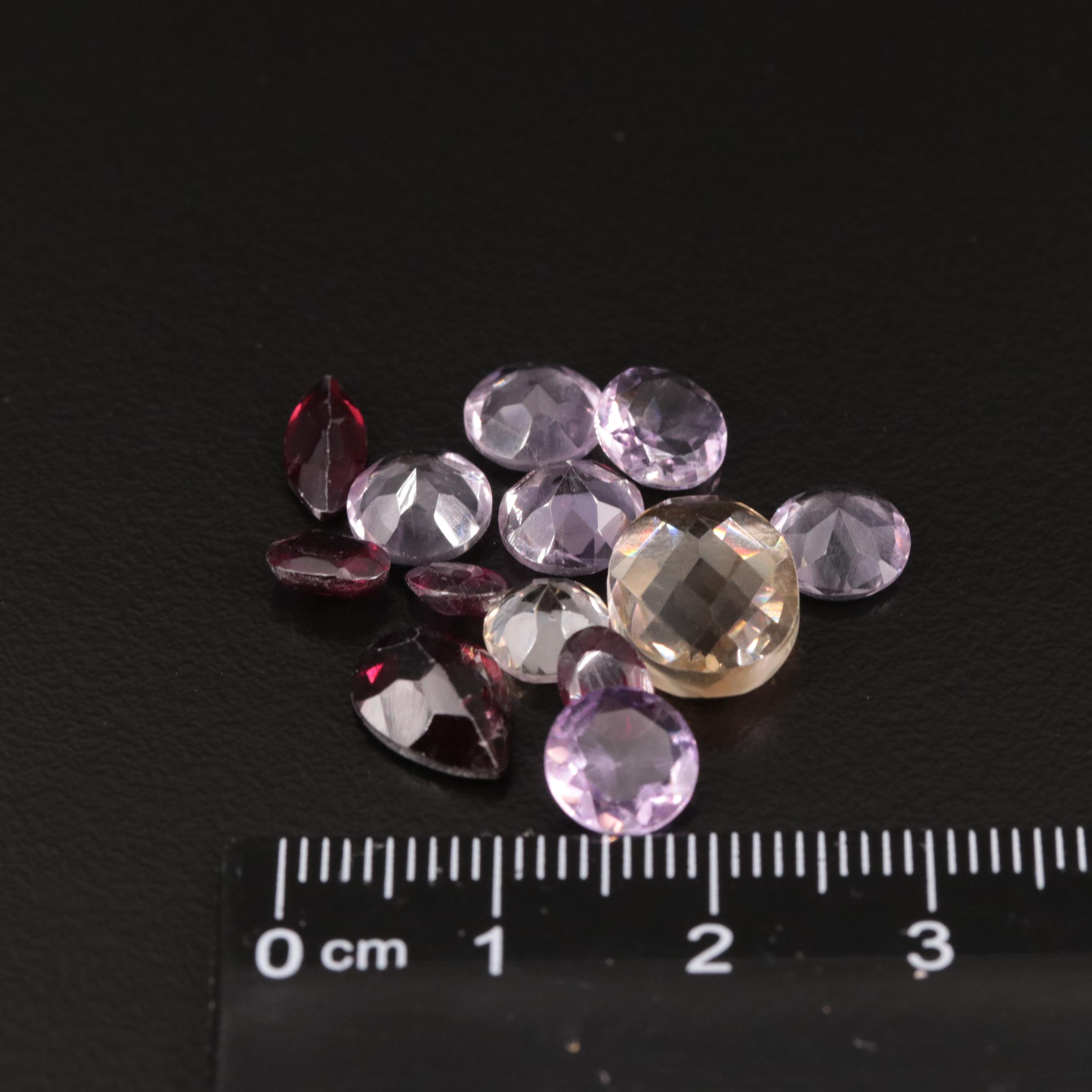 Loose 15.10 Amethyst, Citrine, and Garnet Lot