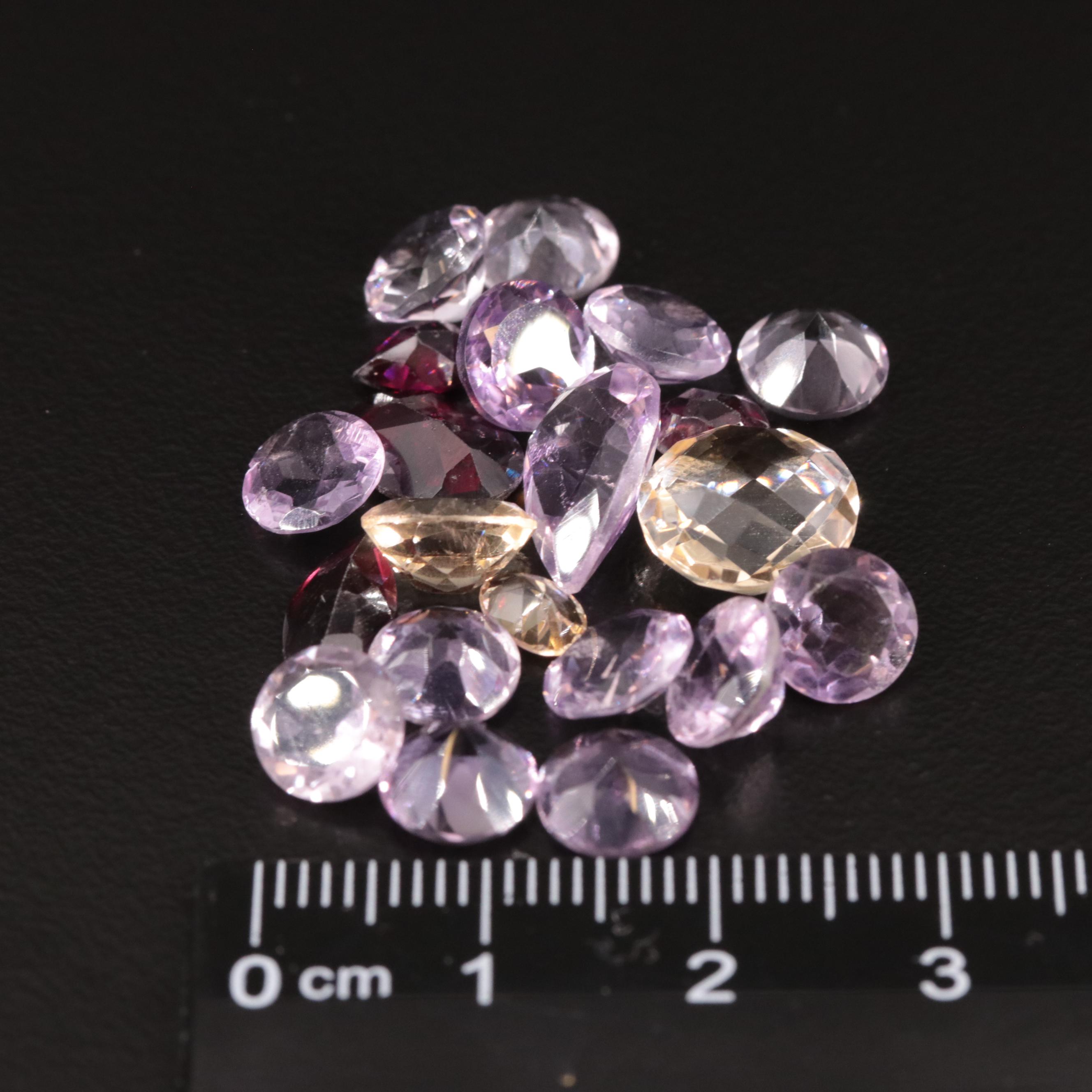 Loose 25.40 CTW Amethyst, Citrine, and Garnet Lot