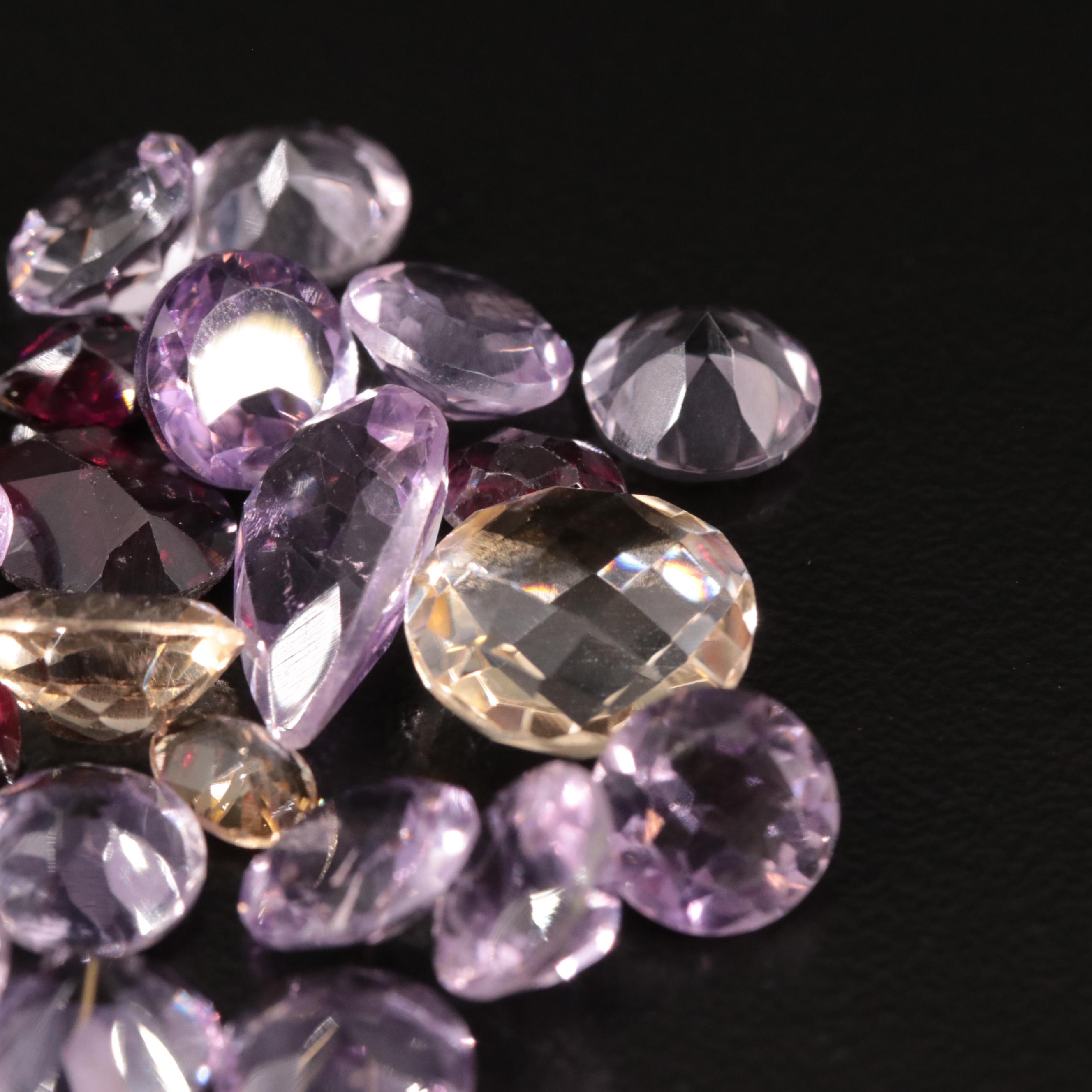 Loose 25.40 CTW Amethyst, Citrine, and Garnet Lot