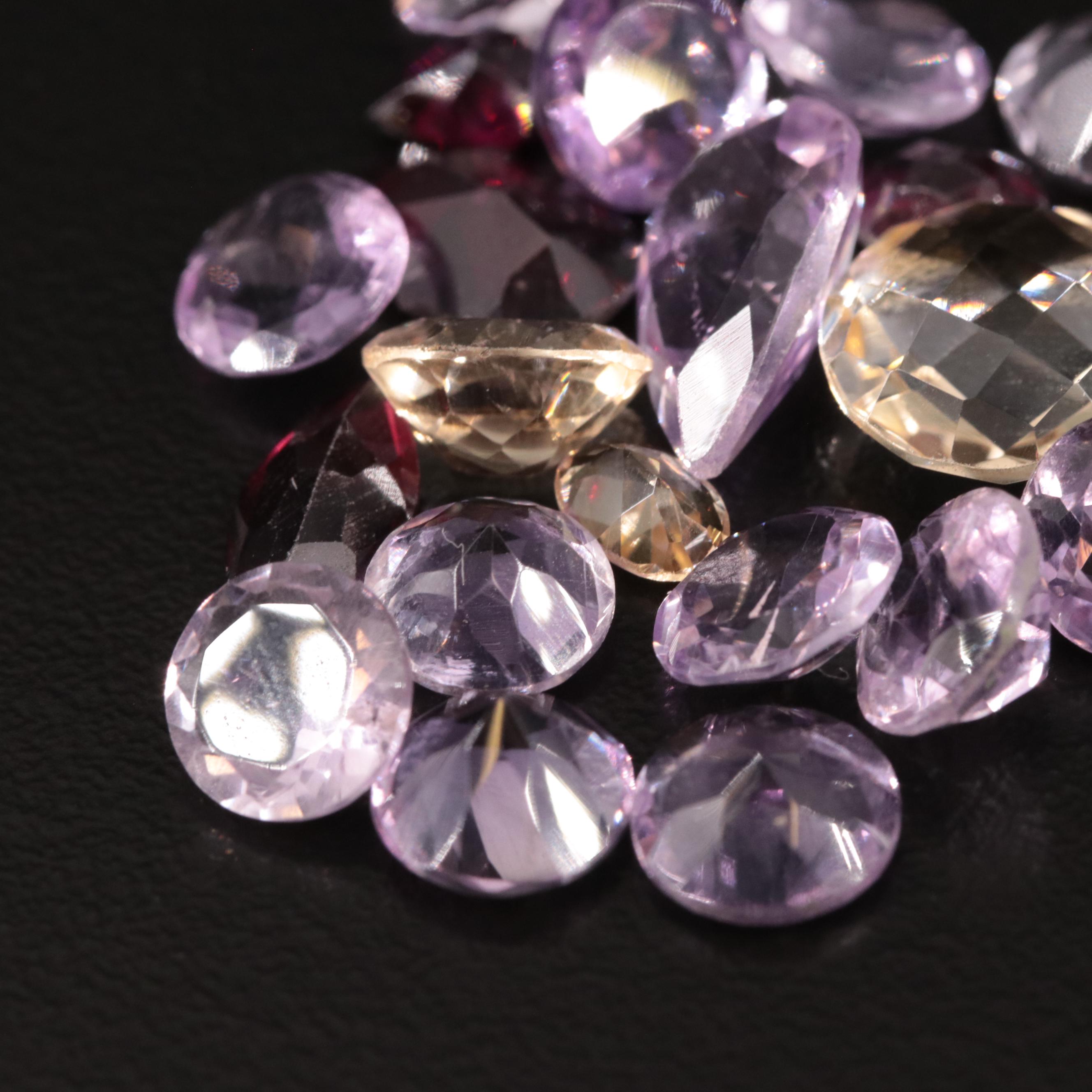 Loose 25.40 CTW Amethyst, Citrine, and Garnet Lot