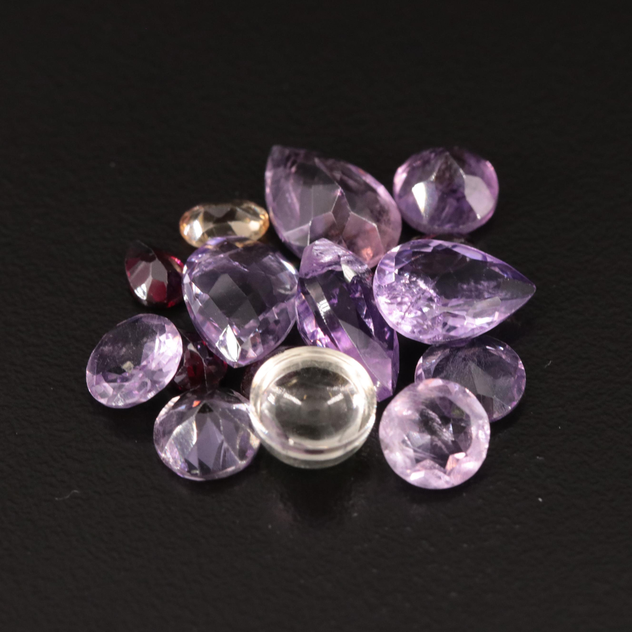 Loose 20.77 CTW Amethyst, Citrine, and Garnet Lot