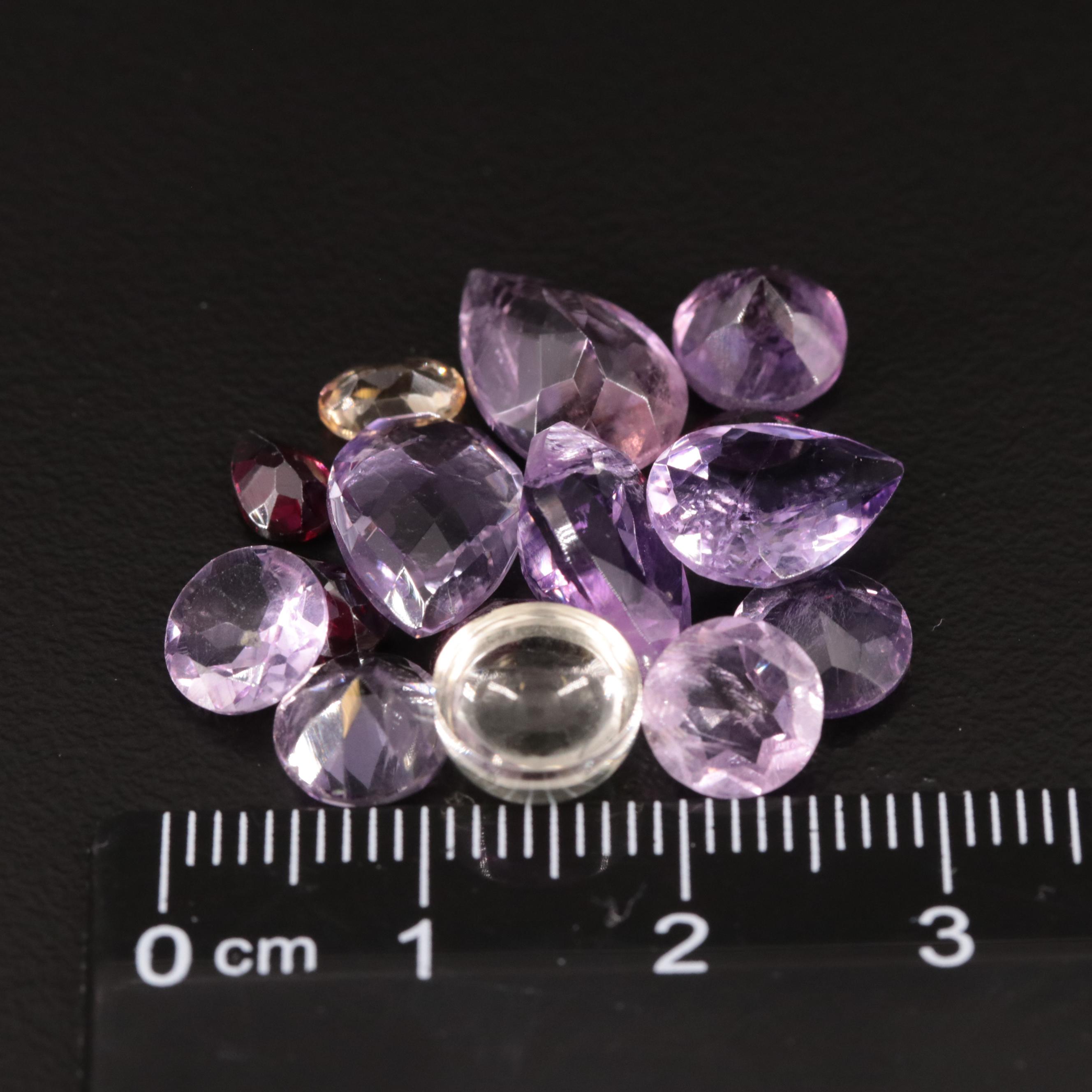 Loose 20.77 CTW Amethyst, Citrine, and Garnet Lot