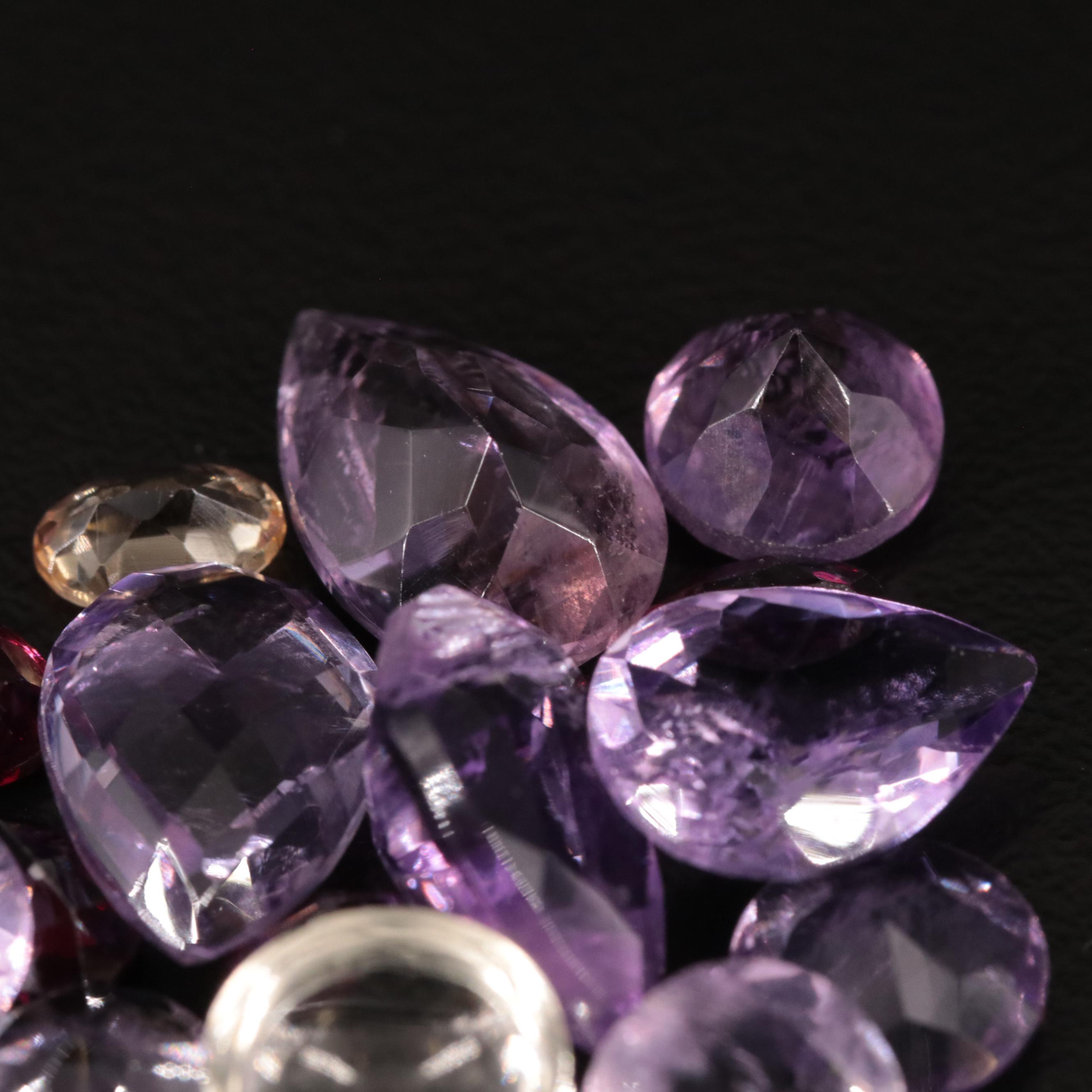 Loose 20.77 CTW Amethyst, Citrine, and Garnet Lot