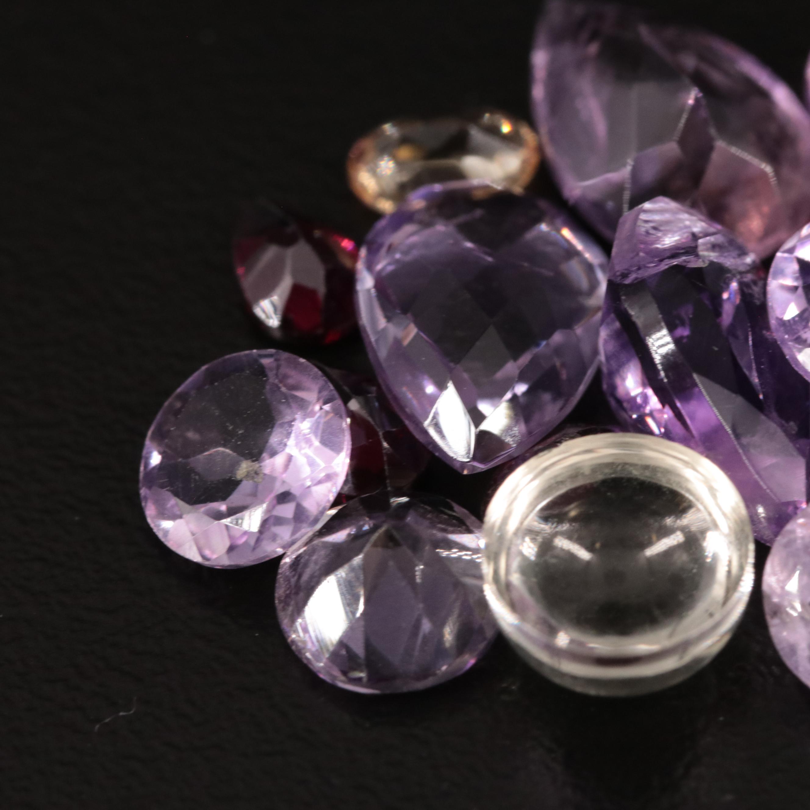 Loose 20.77 CTW Amethyst, Citrine, and Garnet Lot