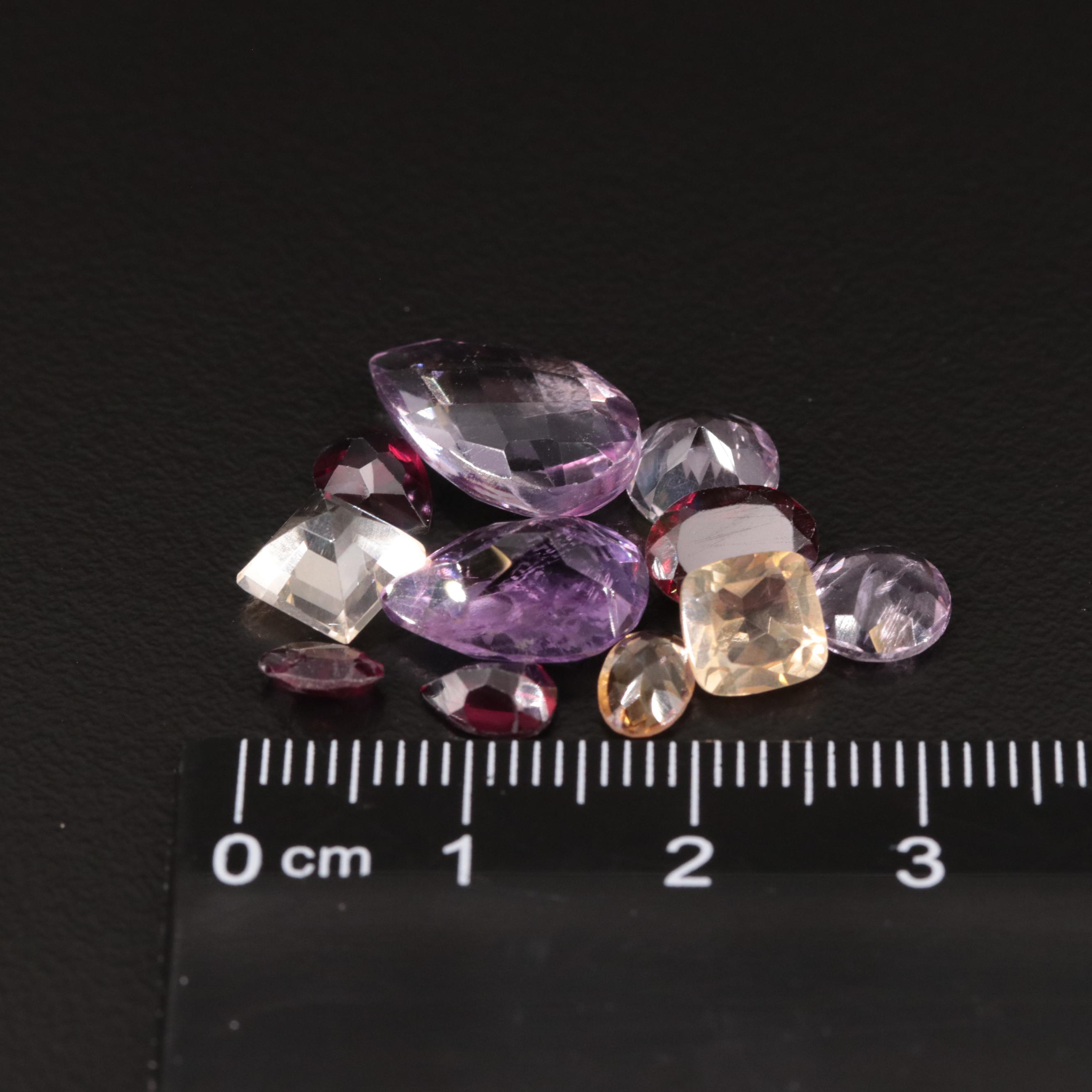 Loose 14.85 CTW Amethyst, Citrine, and Garnet Lot
