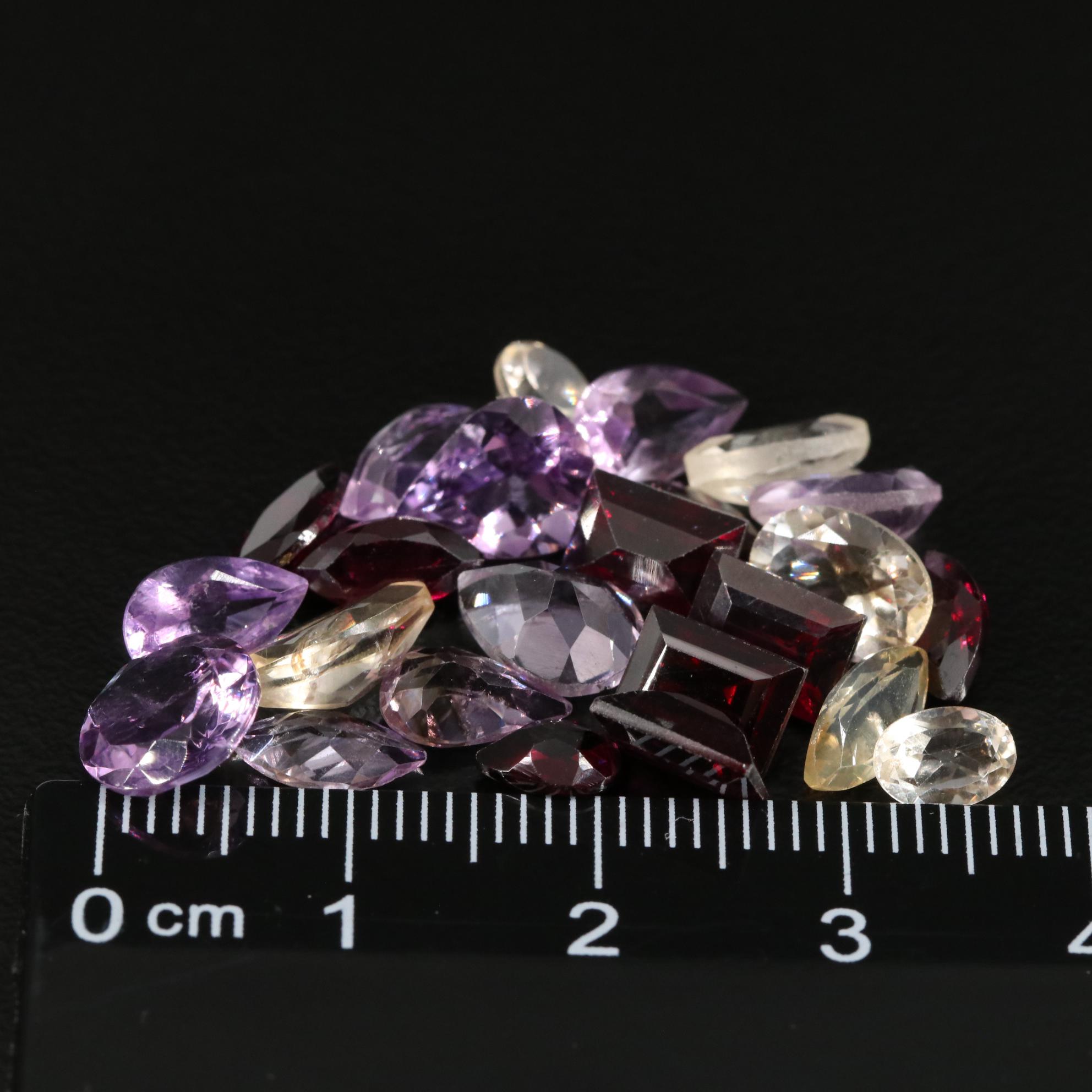 Loose 21.00 CTW Amethyst, Garnet, and Citrine Lot