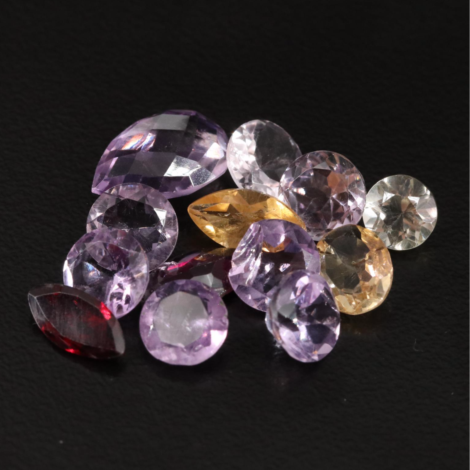 Loose 14.72 CTW Amethyst, Citrine, and Garnet Lot