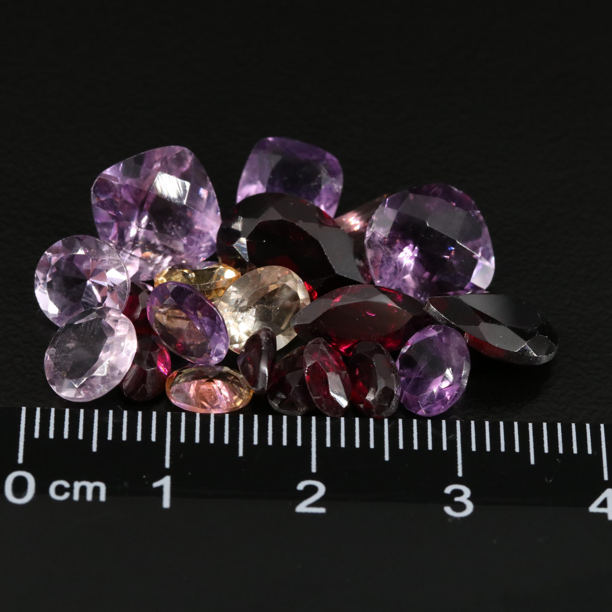 Loose 23.65 CTW Amethyst, Citrine, and Garnet Lot