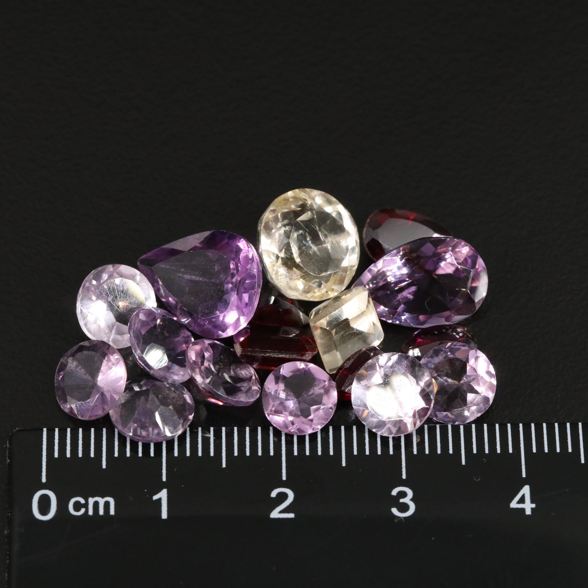Loose 23.22 CTW Amethyst, Citrine, and Garnet Lot