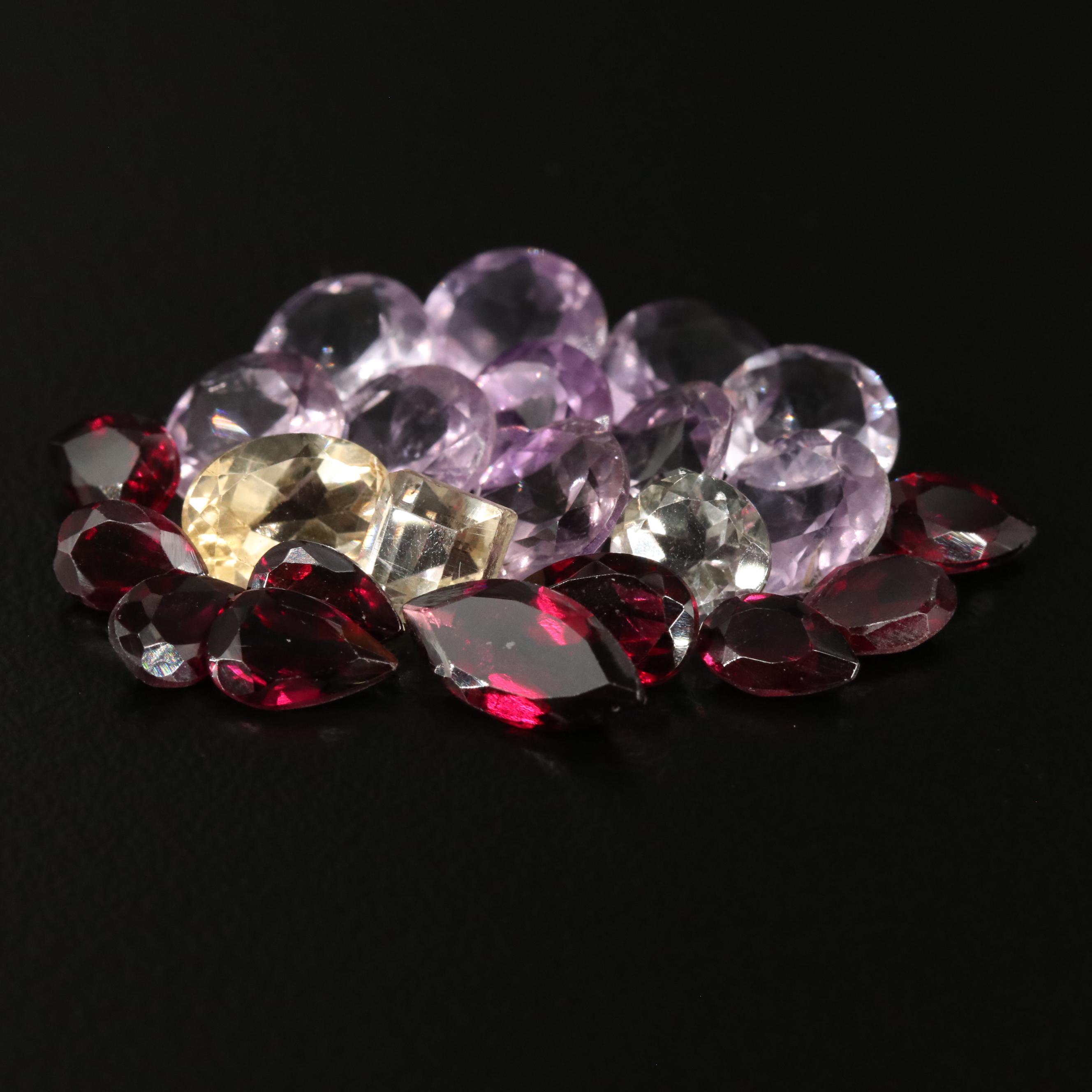 Loose 20.42 CTW Amethyst, Citrine, and Garnet Lot