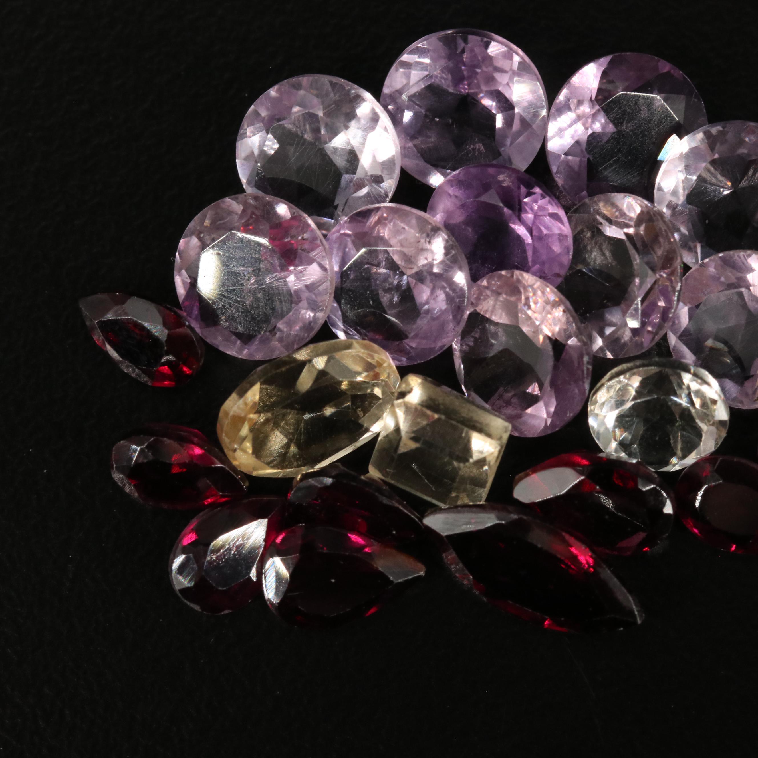 Loose 20.42 CTW Amethyst, Citrine, and Garnet Lot